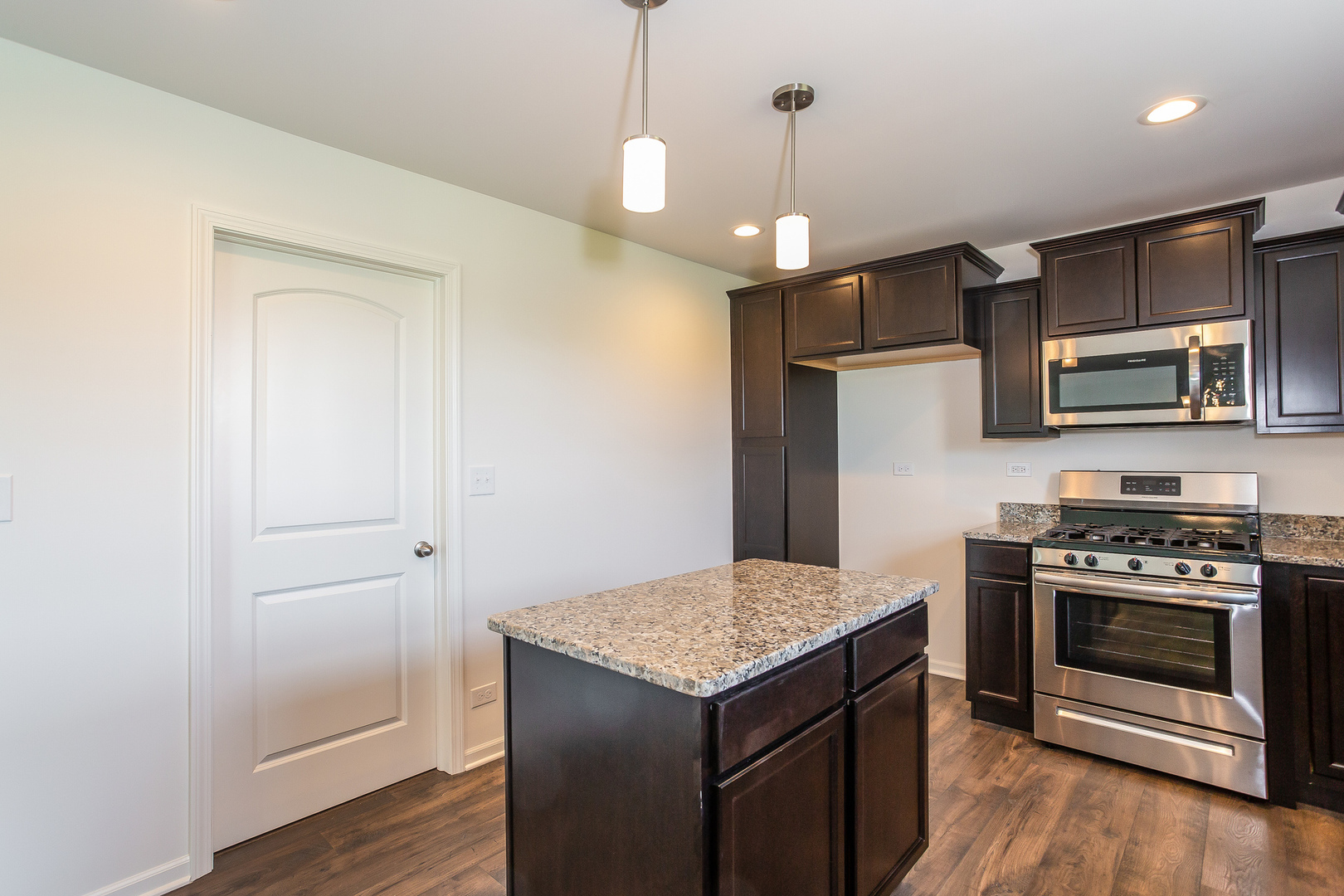 971 Redcliff Road New Lenox, IL 60451 - Photo 4 of 51 a kitchen with a stove and a refrigerator