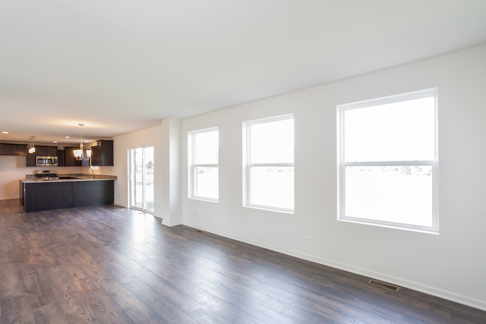 971 Redcliff Road New Lenox, IL 60451 - Photo 6 of 51 a view of a kitchen with a sink and a large window