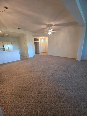 a view of empty room with windows