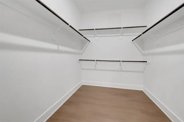 a bathroom with a sink toilet and a mirror