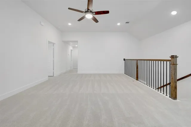 a view of a yard in front of a house with large trees