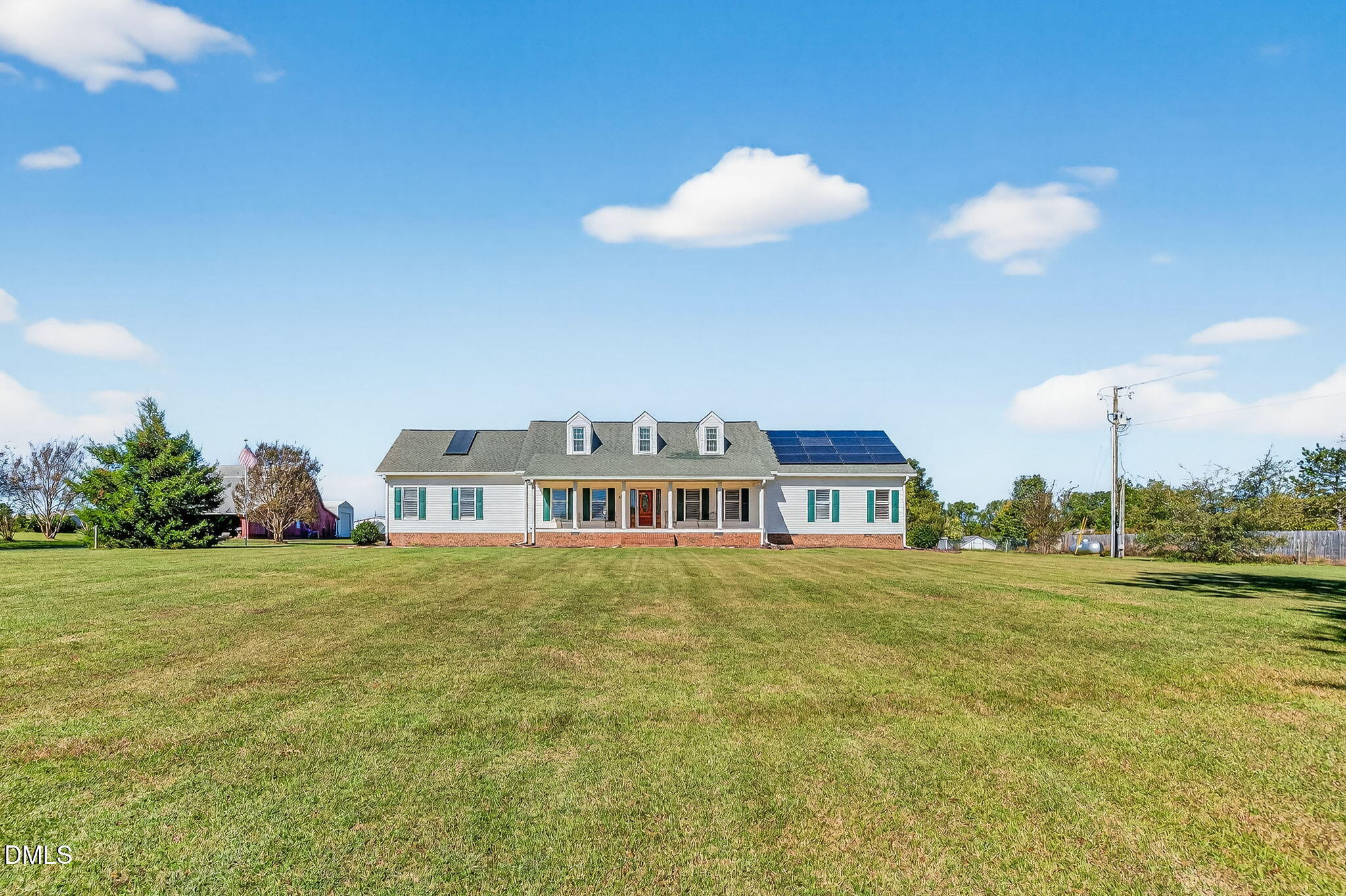 1190 Sanders Road Benson, NC 27504 - Photo 12 of 96 a front view of a house with a big yard