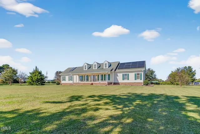 a view of a house with swimming pool