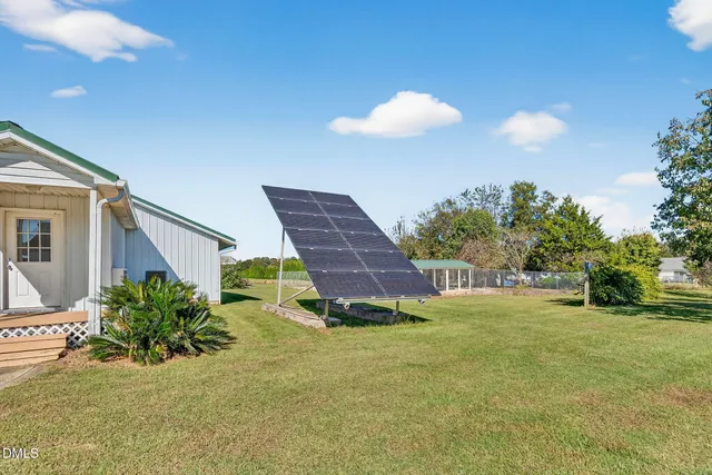 a bedroom with two beds and a chandelier