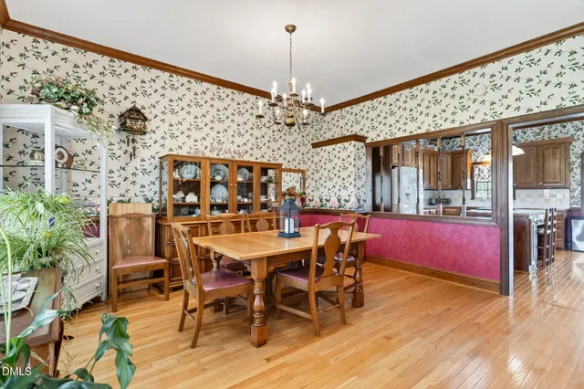 a bedroom with bed and wooden floor