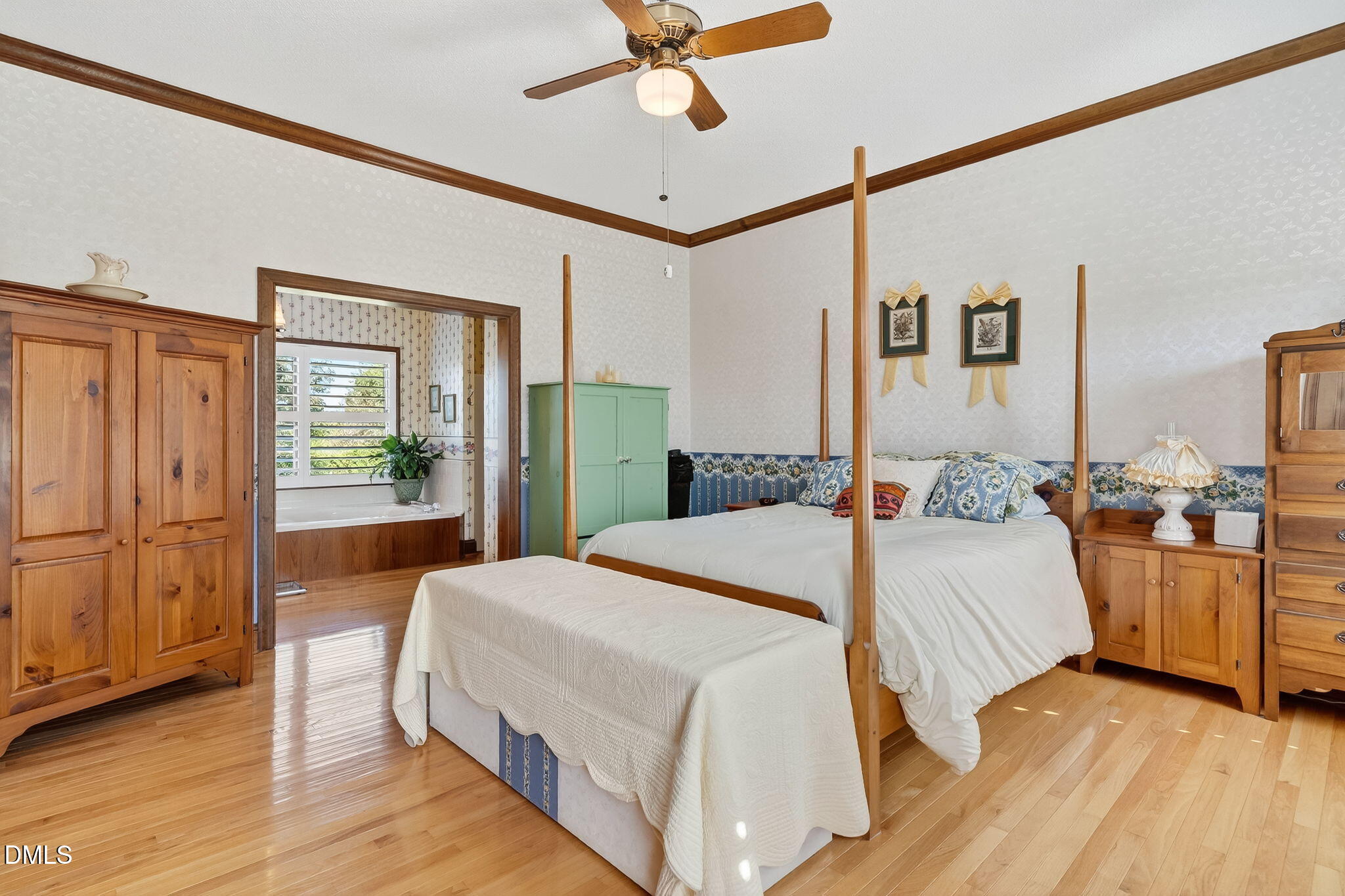 1190 Sanders Road Benson, NC 27504 - Photo 43 of 96 a bedroom with a bed and wooden floor