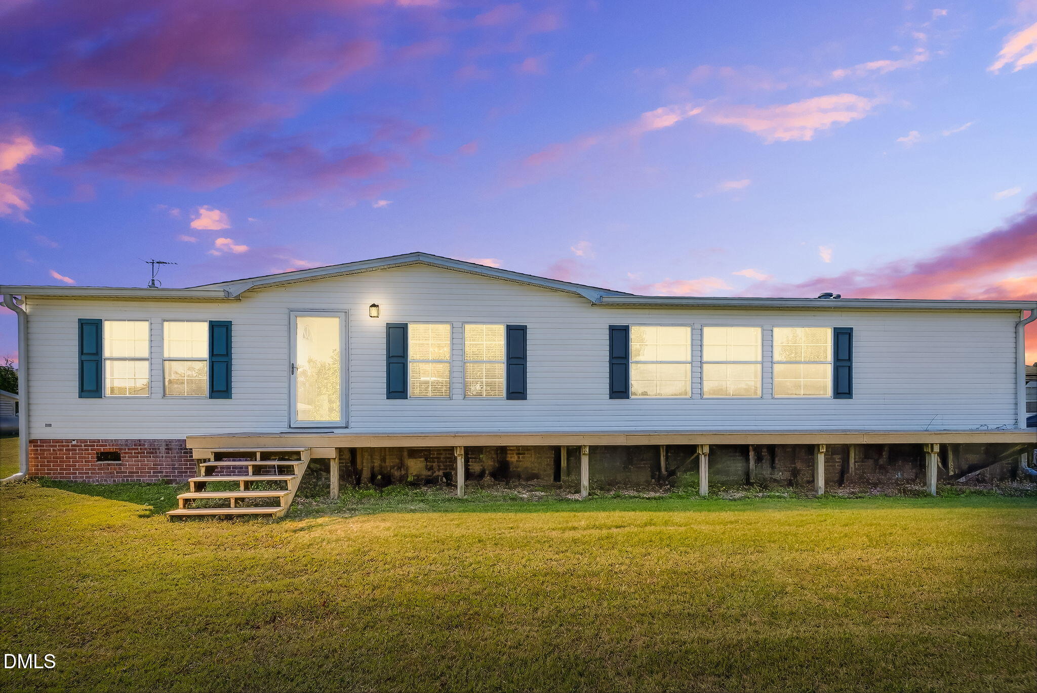 1190 Sanders Road Benson, NC 27504 - Photo 55 of 96 a front view of a house with a yard