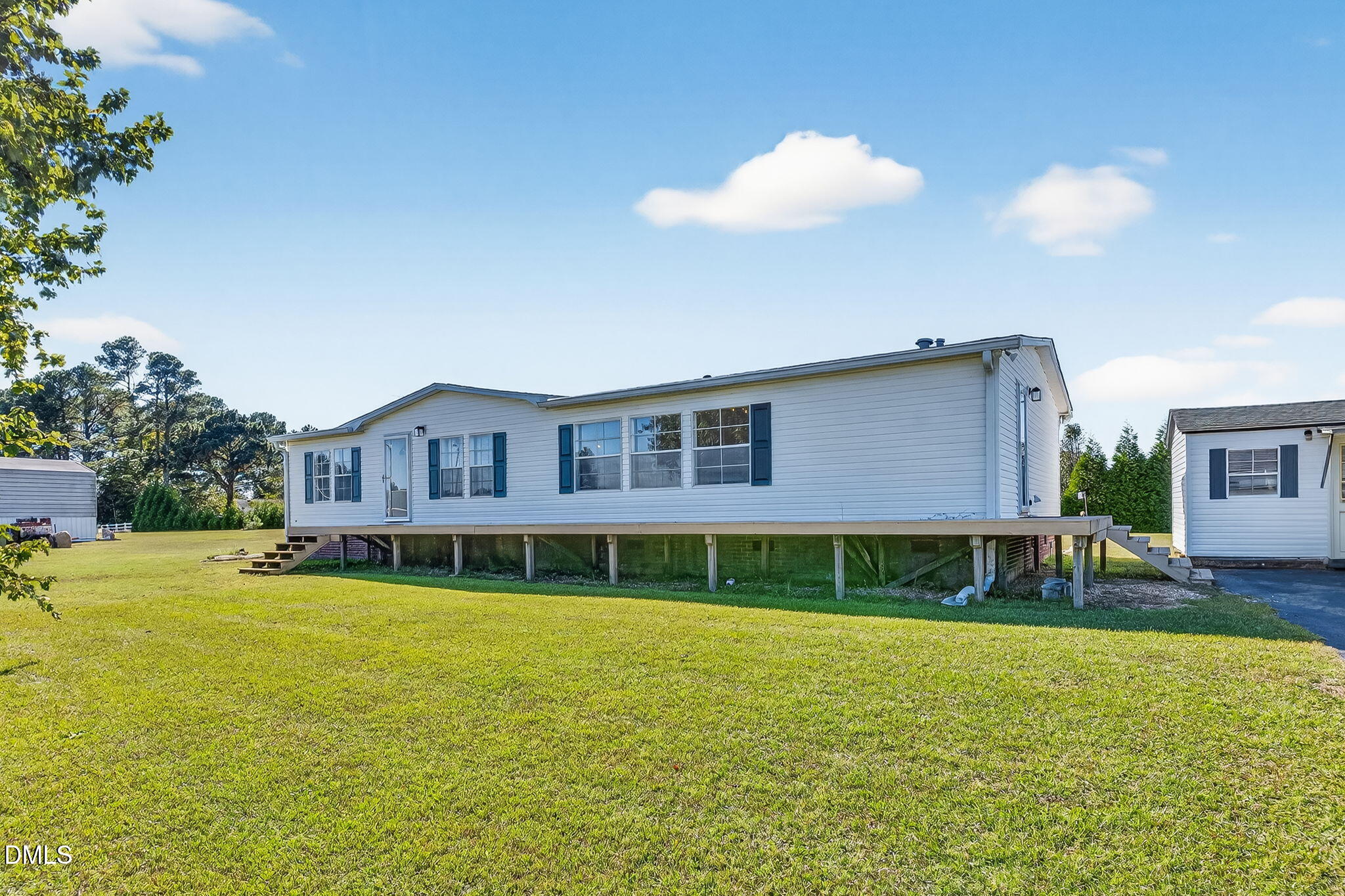 1190 Sanders Road Benson, NC 27504 - Photo 56 of 96 a front view of a house with a yard