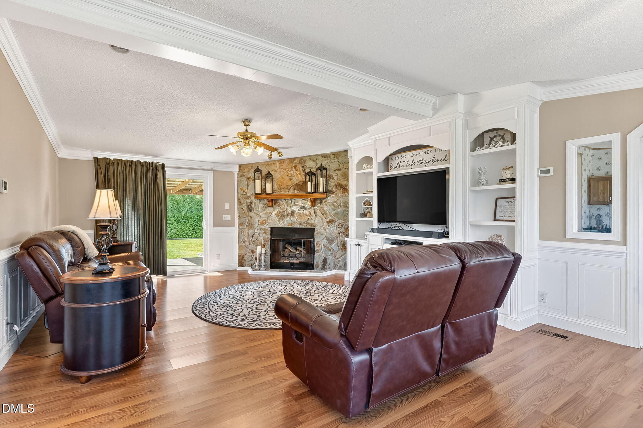 1190 Sanders Road Benson, NC 27504 - Photo 58 of 96 a living room with furniture fireplace and flat screen tv
