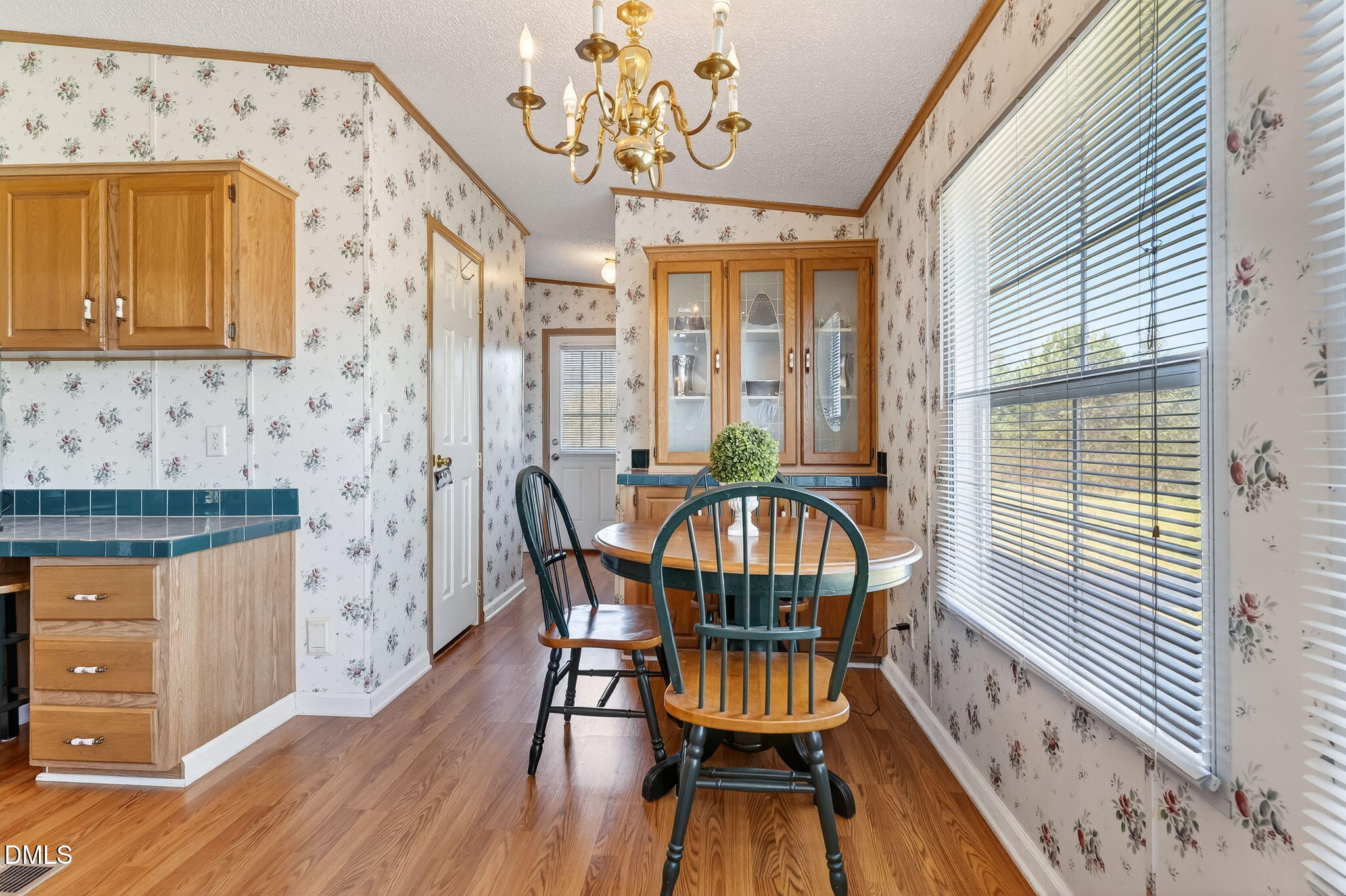 1190 Sanders Road Benson, NC 27504 - Photo 65 of 96 a view of a dining room with furniture and wooden floor