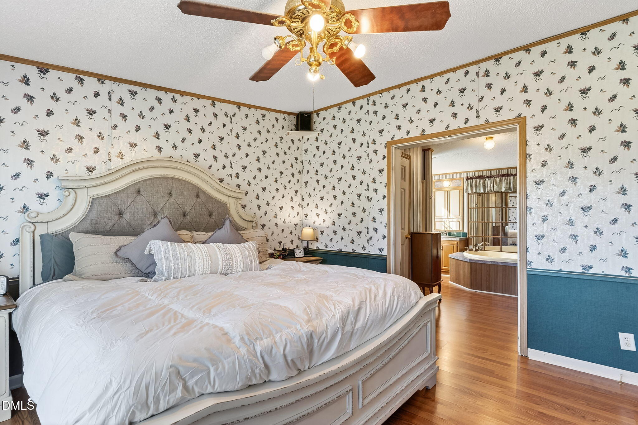 1190 Sanders Road Benson, NC 27504 - Photo 68 of 96 a bedroom with bed and wooden floor