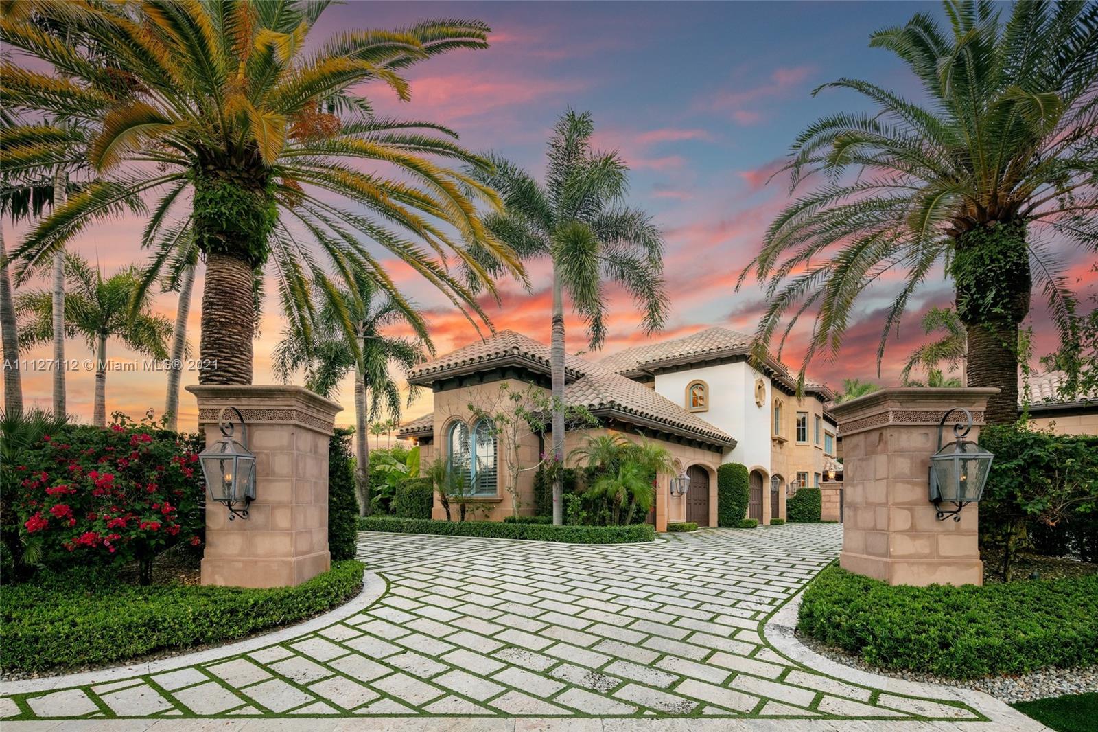 372 Regatta Drive Jupiter, FL 33477 - Photo 11 of 93 a front view of a house with a yard and potted plants