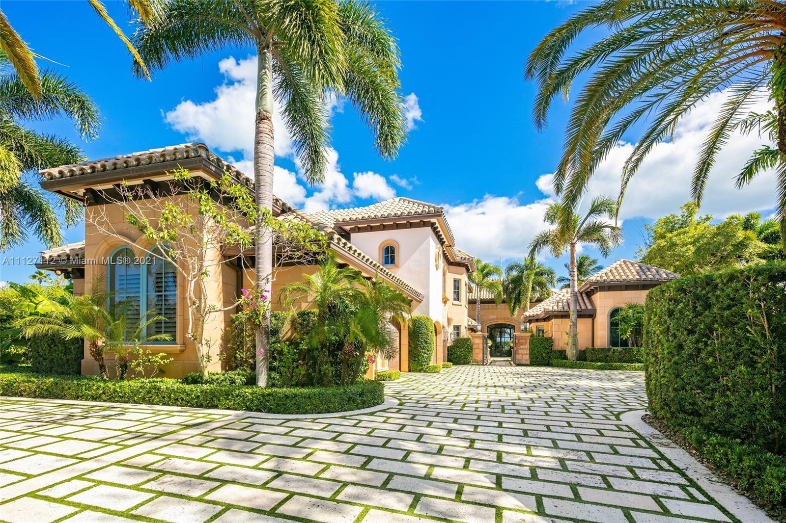 372 Regatta Drive Jupiter, FL 33477 - Photo 12 of 93 a view of a white building with many windows