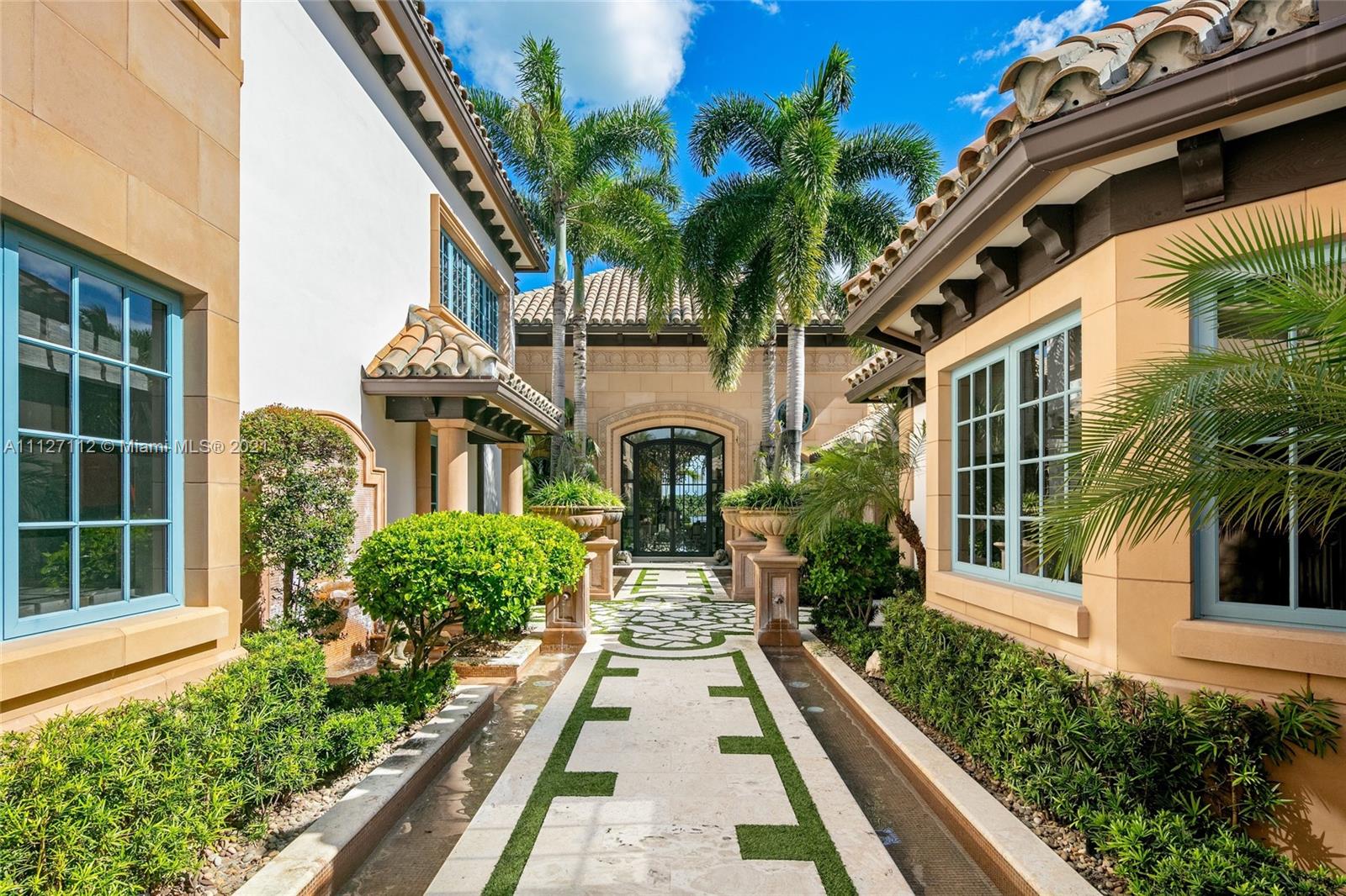 372 Regatta Drive Jupiter, FL 33477 - Photo 15 of 93 a front view of a house with a yard