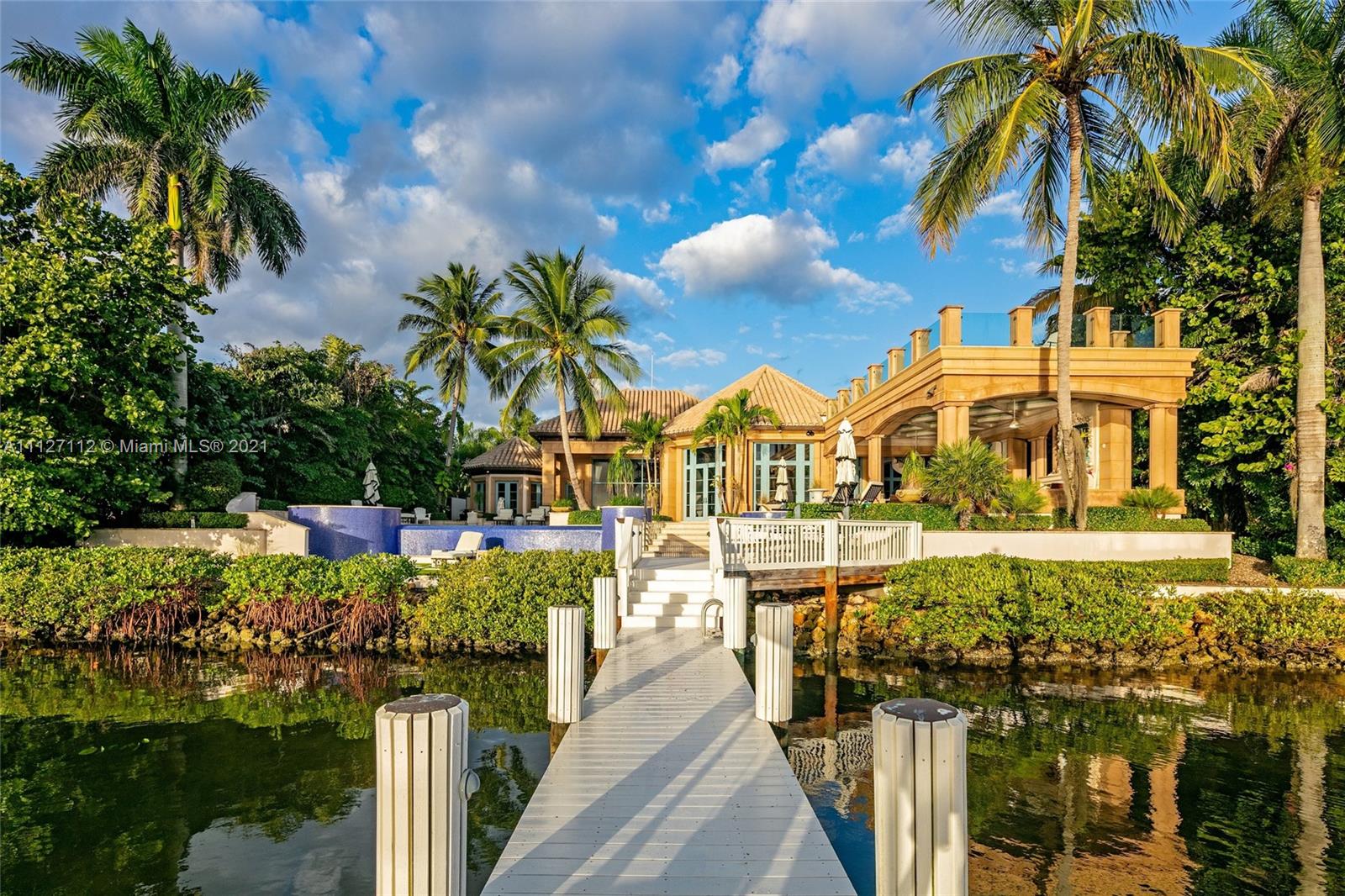 372 Regatta Drive Jupiter, FL 33477 - Photo 3 of 93 a view of a house with a yard and potted plants