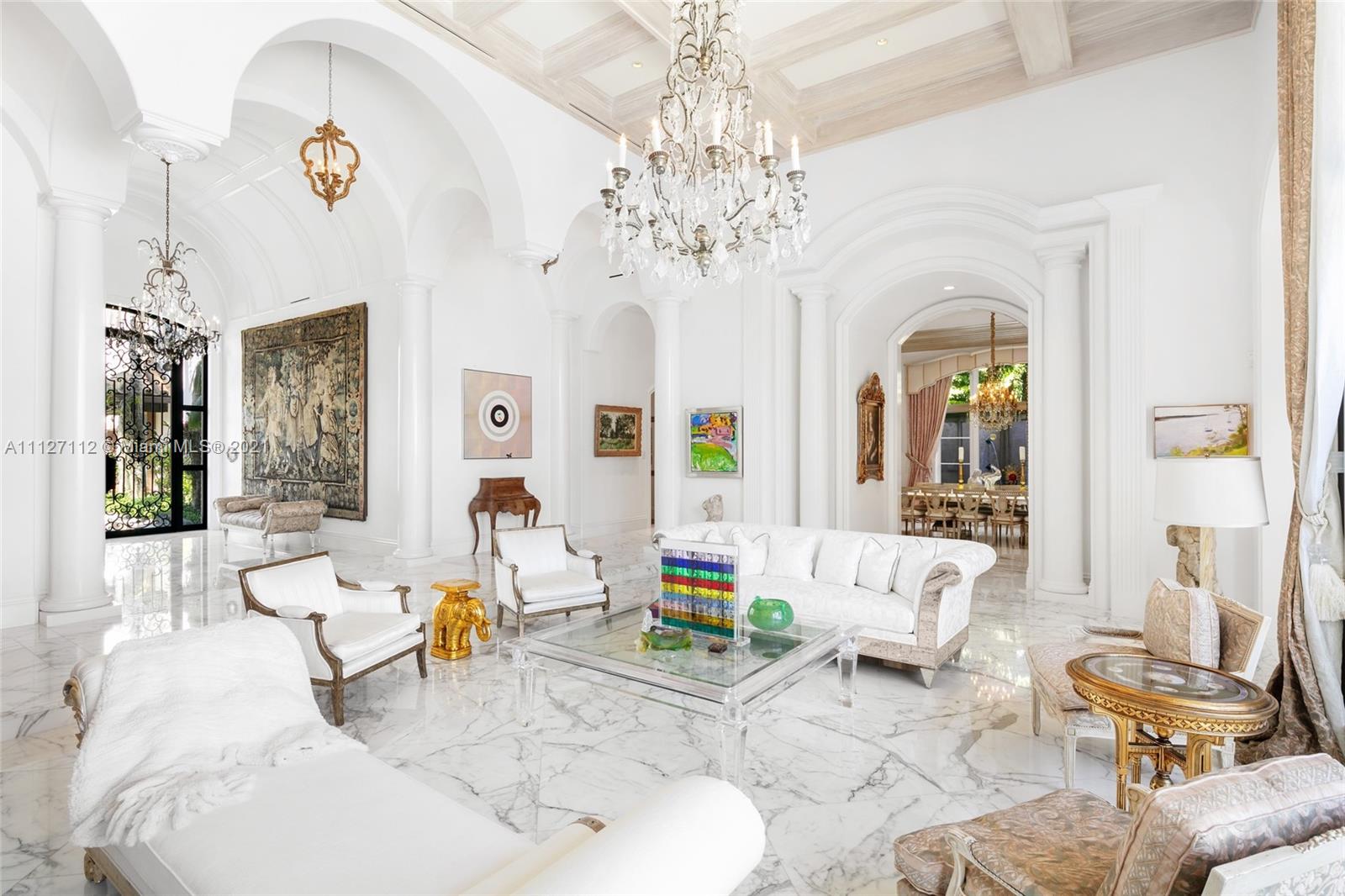 372 Regatta Drive Jupiter, FL 33477 - Photo 25 of 93 a living room with patio furniture and a chandelier