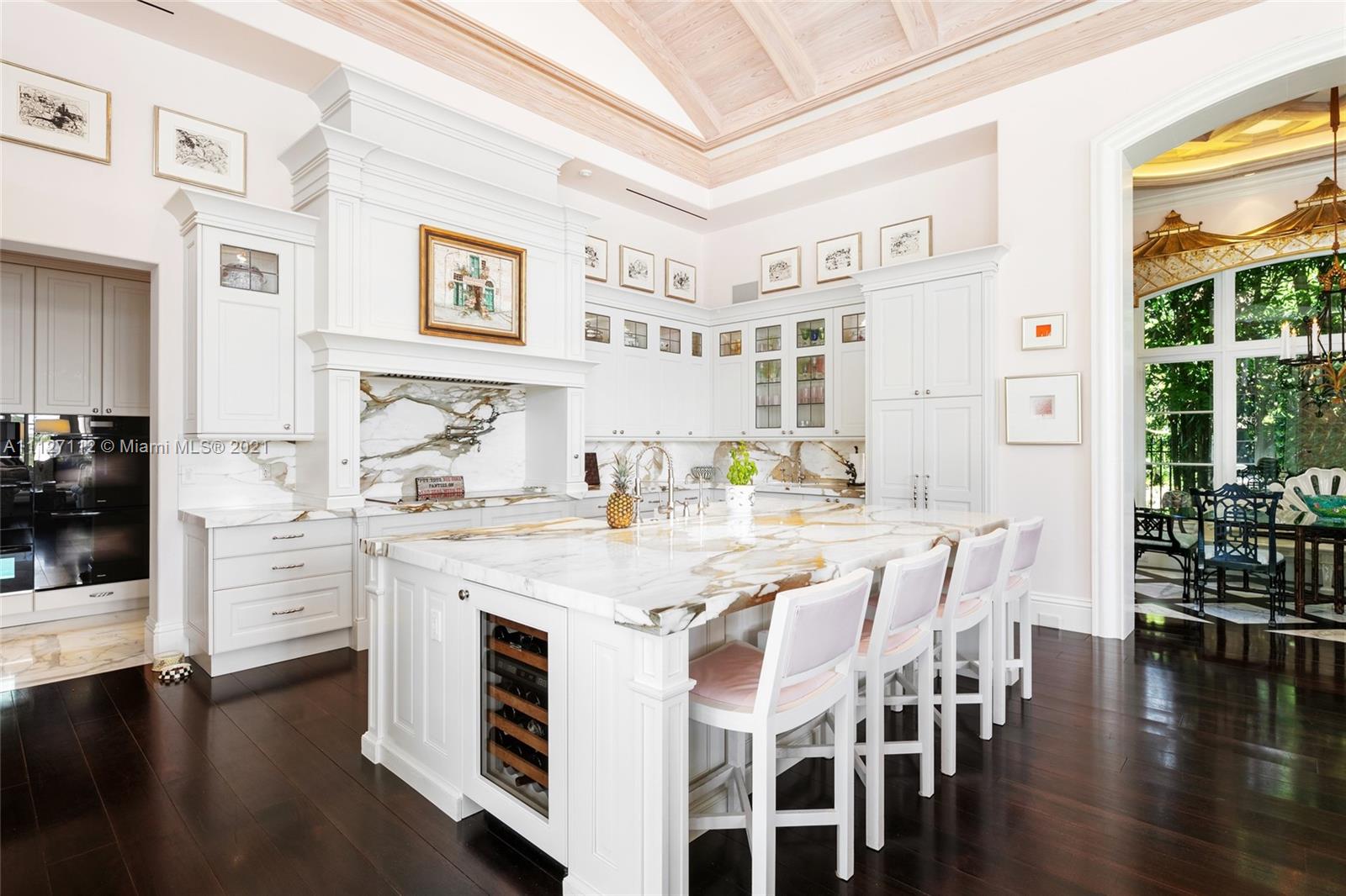 372 Regatta Drive Jupiter, FL 33477 - Photo 28 of 93 a view of a dining room with furniture and wooden floor