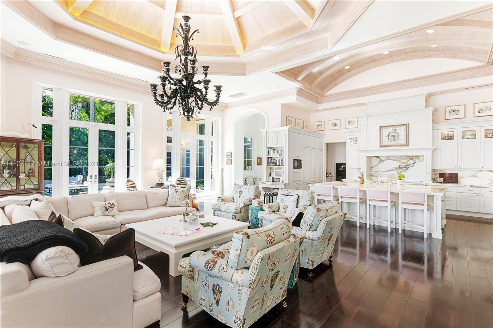 372 Regatta Drive Jupiter, FL 33477 - Photo 33 of 93 a living room with furniture dining table and a chandelier