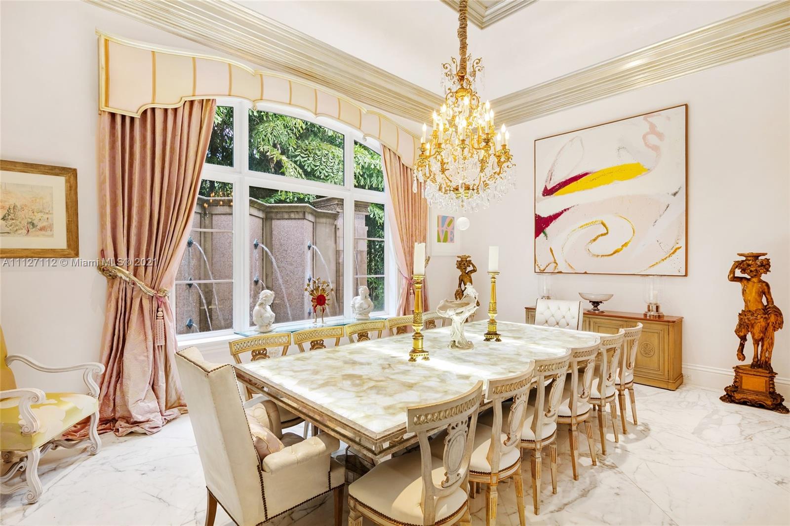 372 Regatta Drive Jupiter, FL 33477 - Photo 37 of 93 a view of a dining room with furniture a chandelier and large windows