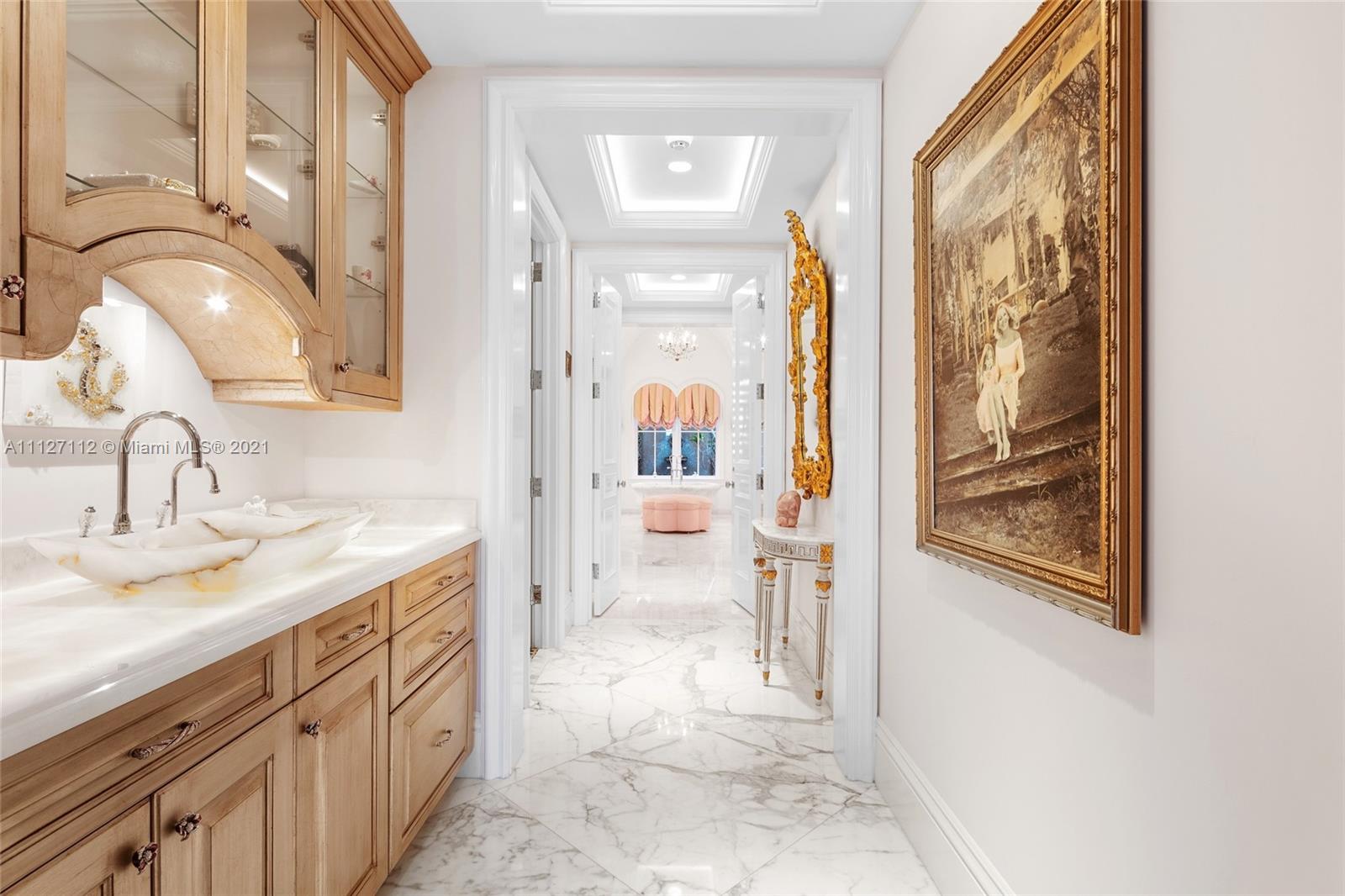 372 Regatta Drive Jupiter, FL 33477 - Photo 41 of 93 a bathroom with a sink a mirror and a shower