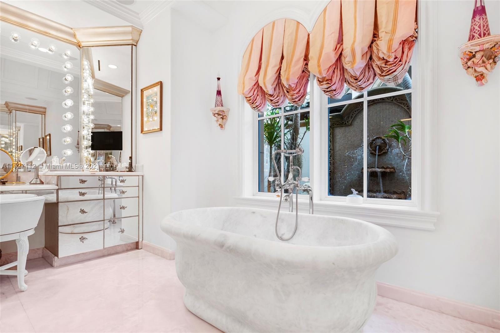 372 Regatta Drive Jupiter, FL 33477 - Photo 44 of 93 a bathroom with a sink and a mirror