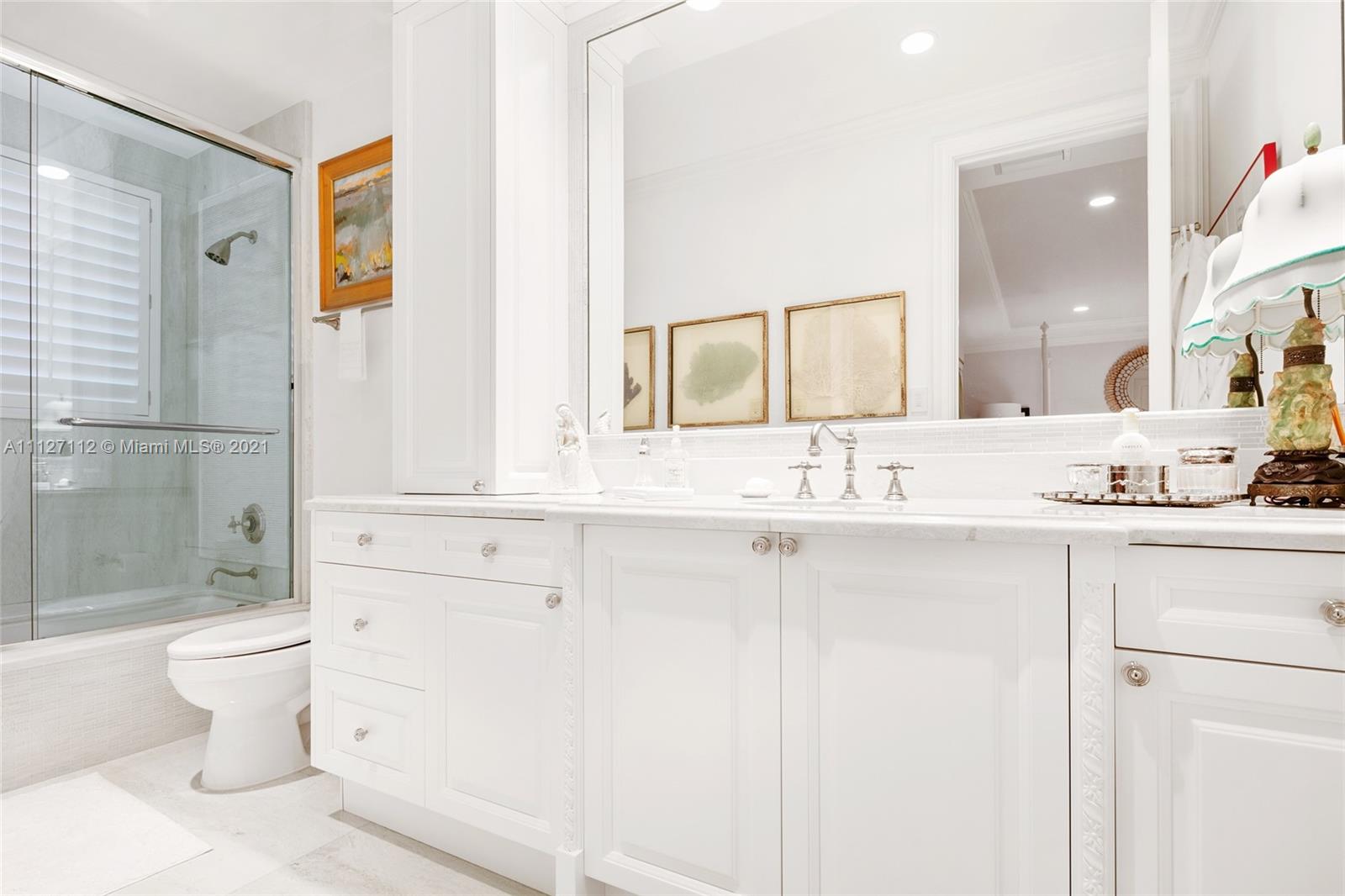 372 Regatta Drive Jupiter, FL 33477 - Photo 55 of 93 a bathroom with a sink and a mirror