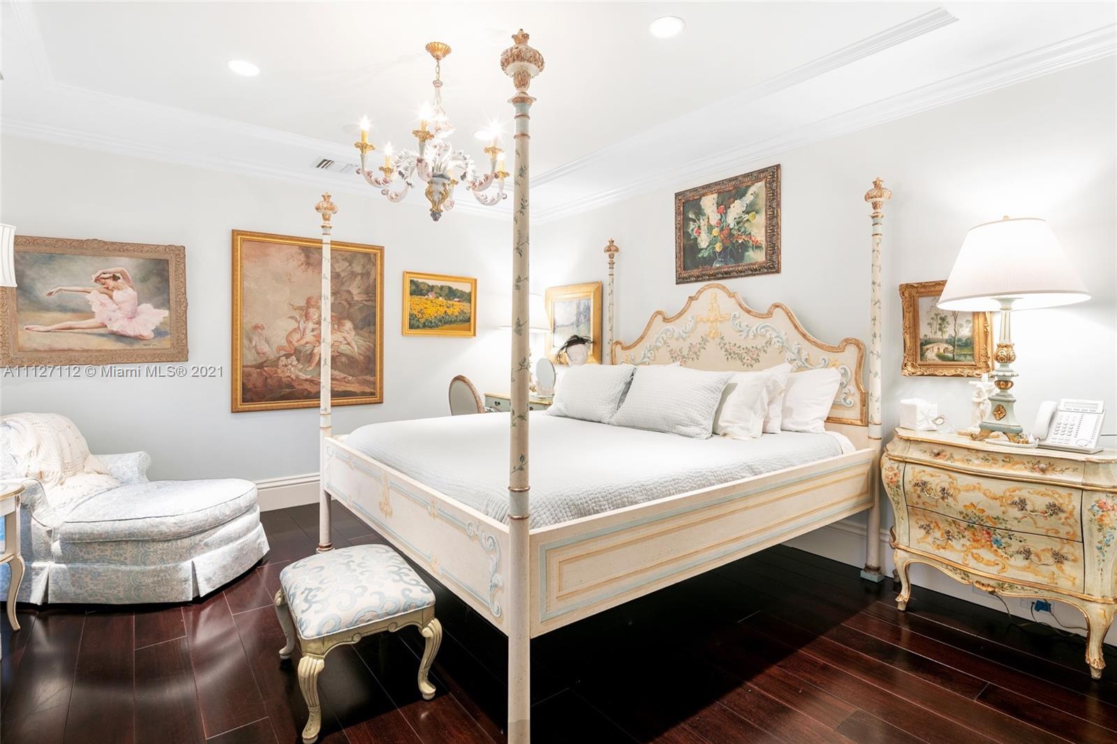 372 Regatta Drive Jupiter, FL 33477 - Photo 56 of 93 a bedroom with a bed and a chandelier