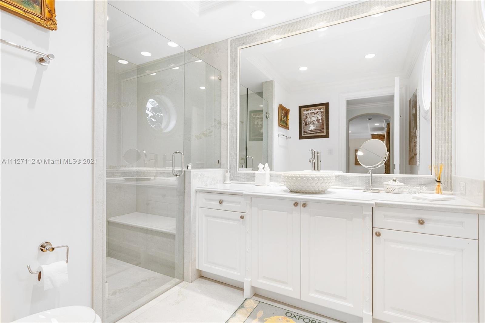 372 Regatta Drive Jupiter, FL 33477 - Photo 57 of 93 a bathroom with a sink and a mirror