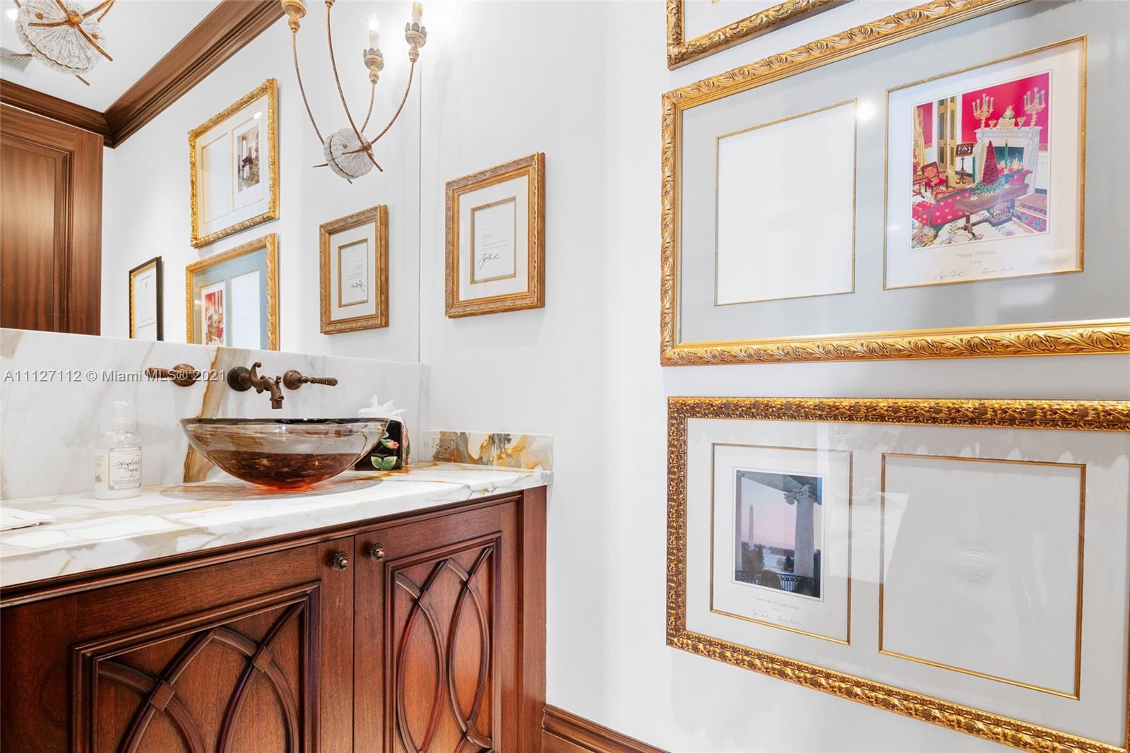 372 Regatta Drive Jupiter, FL 33477 - Photo 64 of 93 a bathroom with a sink a vanity and a mirror
