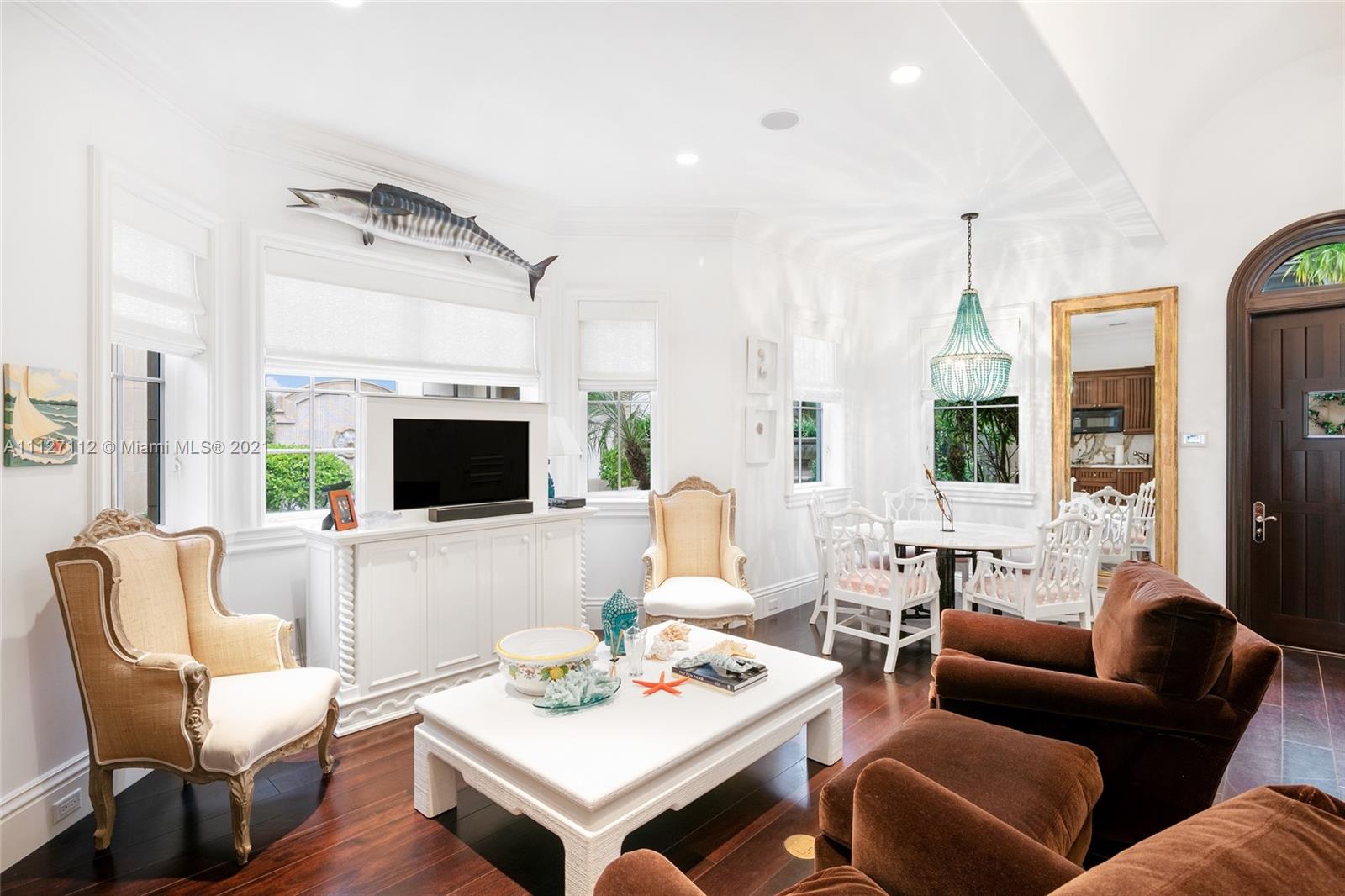 372 Regatta Drive Jupiter, FL 33477 - Photo 72 of 93 a living room with furniture a flat screen tv and a large window