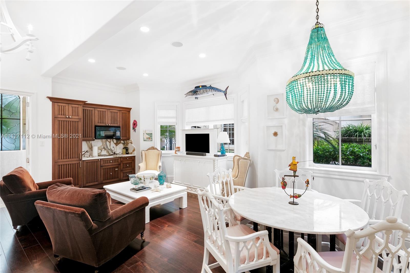 372 Regatta Drive Jupiter, FL 33477 - Photo 73 of 93 a living room with furniture a chandelier and a large window