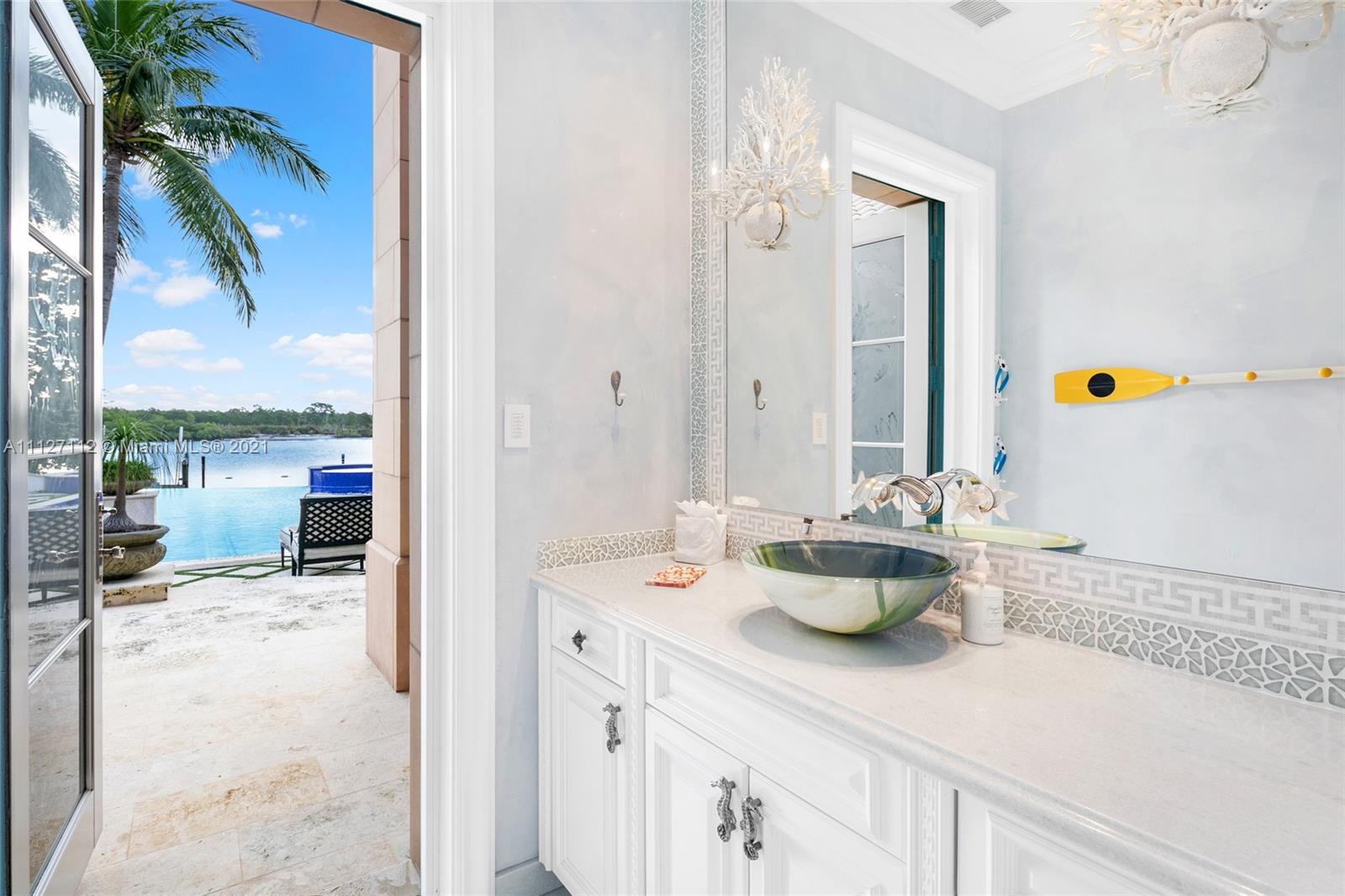 372 Regatta Drive Jupiter, FL 33477 - Photo 85 of 93 a kitchen with a sink and wooden floor