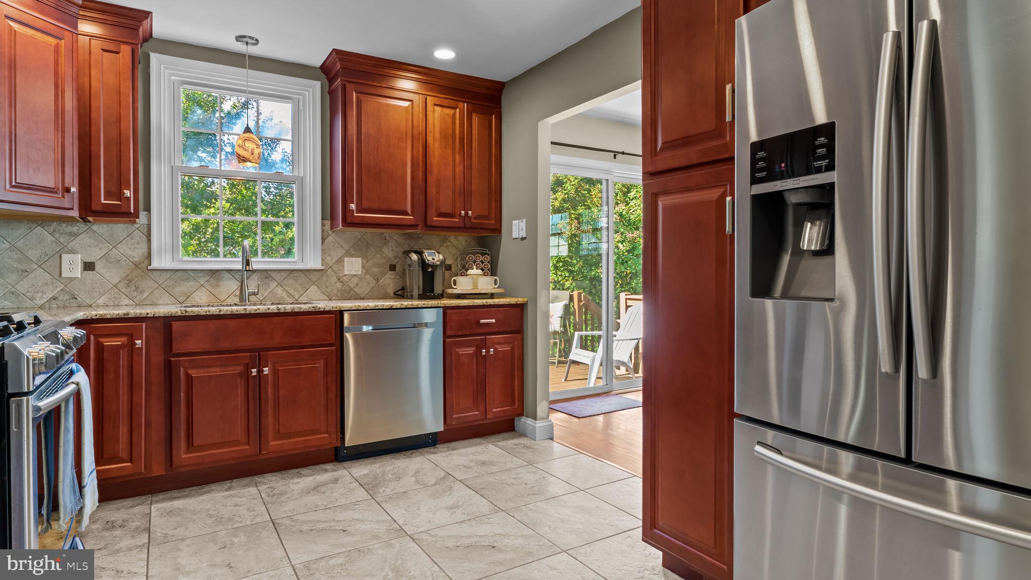 1002 Windsor Road Warminster, PA 18974 - Photo 15 of 57 a kitchen with stainless steel appliances granite countertop a refrigerator and a sink