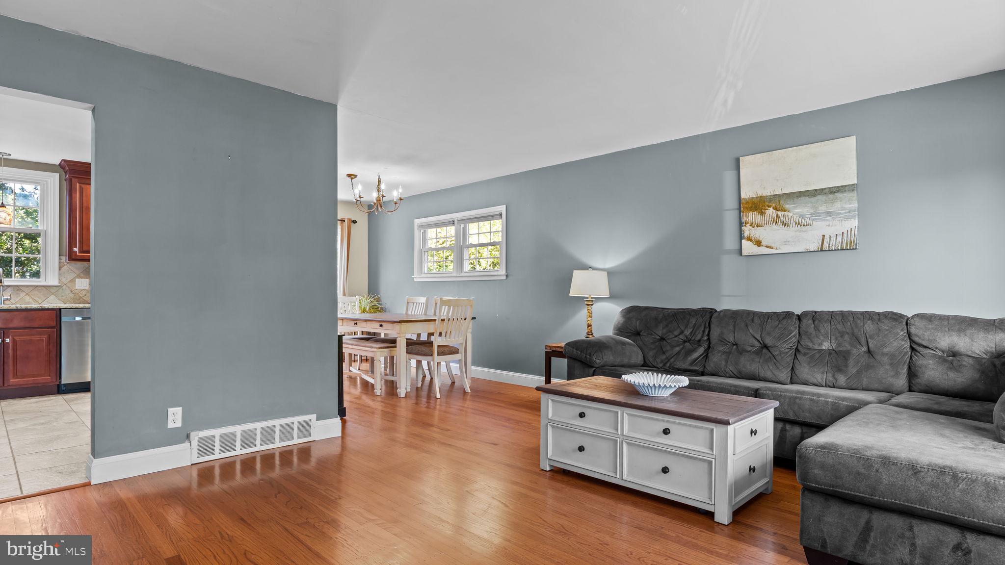 1002 Windsor Road Warminster, PA 18974 - Photo 19 of 57 a living room with furniture and a wooden floor