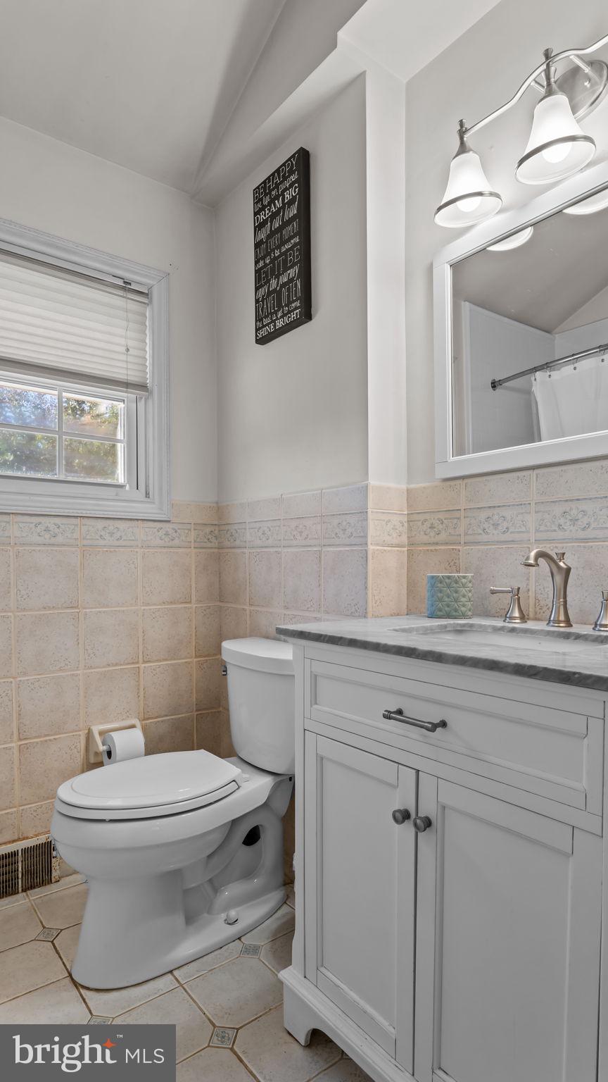 1002 Windsor Road Warminster, PA 18974 - Photo 41 of 57 a bathroom with a toilet sink and mirror