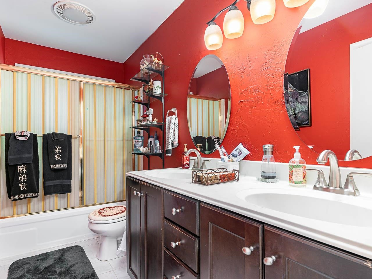 2104 Jarman Drive Raleigh, NC 27604 - Photo 22 of 37 a bathroom with a sink and a mirror