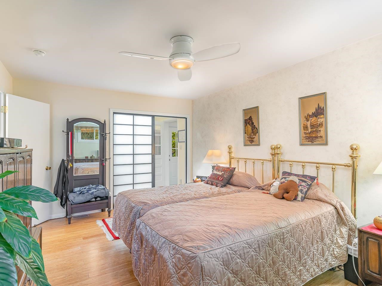 2104 Jarman Drive Raleigh, NC 27604 - Photo 24 of 37 a bedroom with a bed and wooden floor