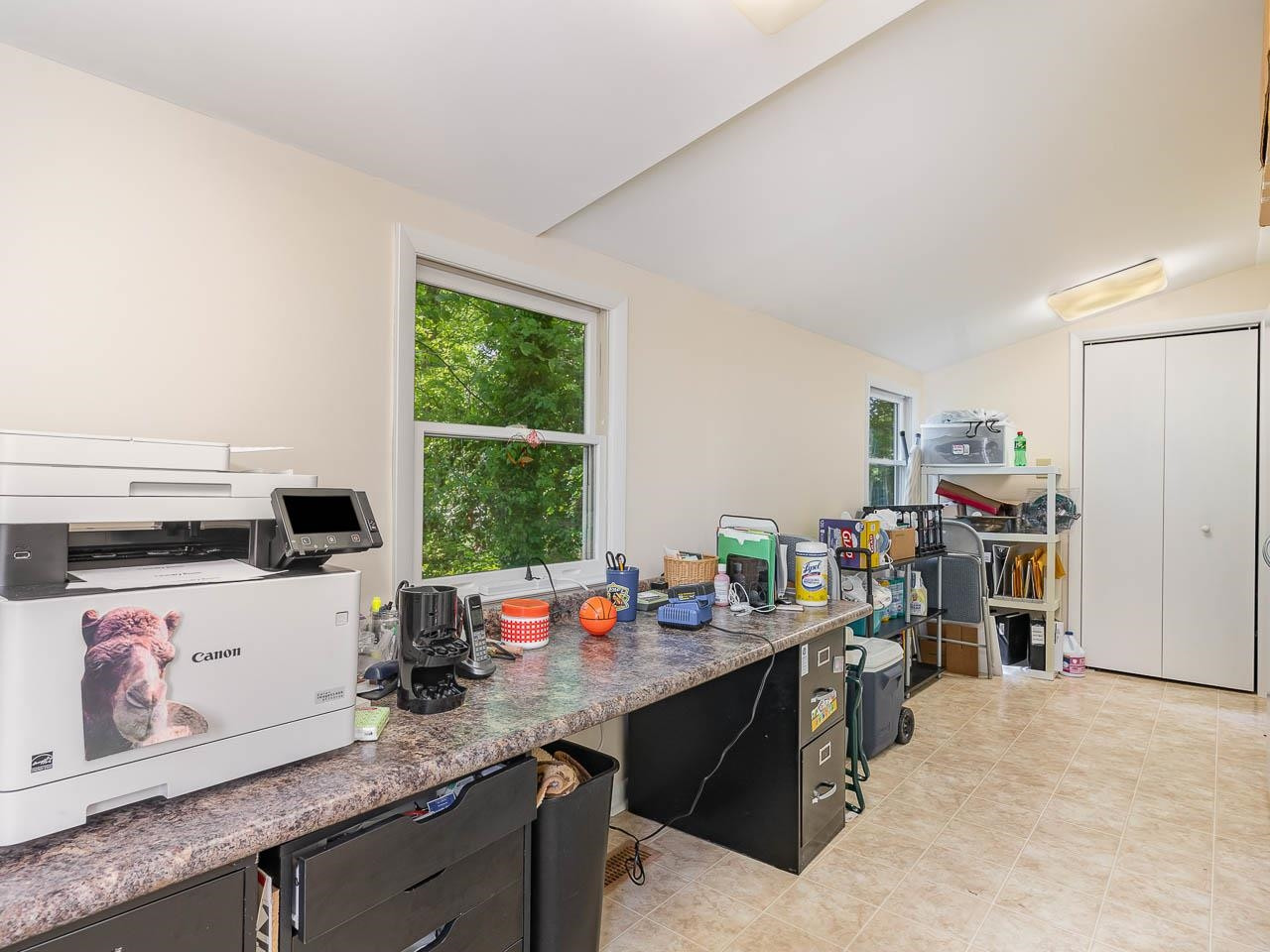 2104 Jarman Drive Raleigh, NC 27604 - Photo 27 of 37 a room with furniture a flat screen tv and a window
