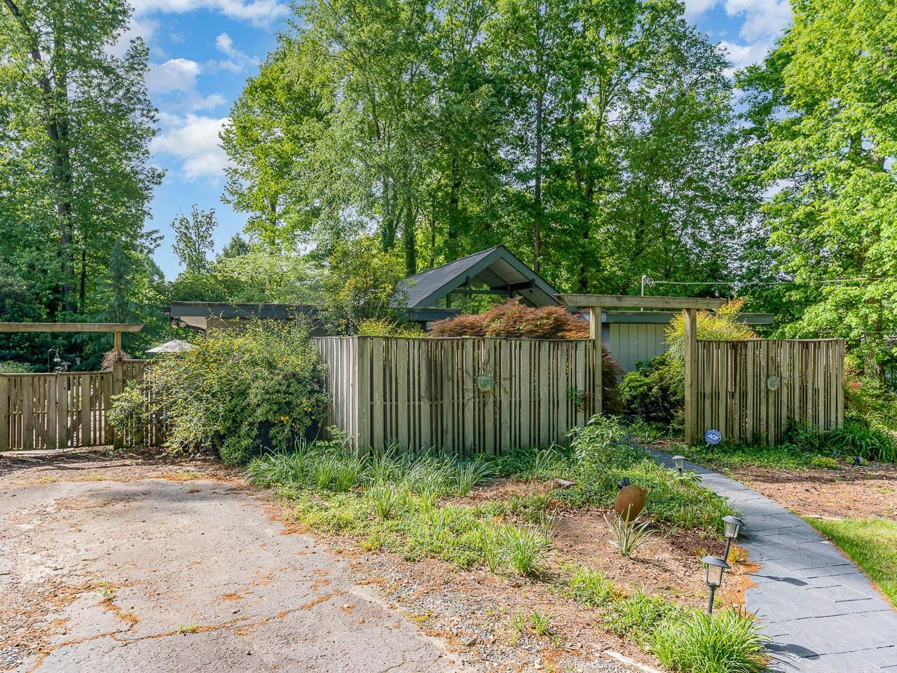 2104 Jarman Drive Raleigh, NC 27604 - Photo 5 of 37 a front view of a house with garden