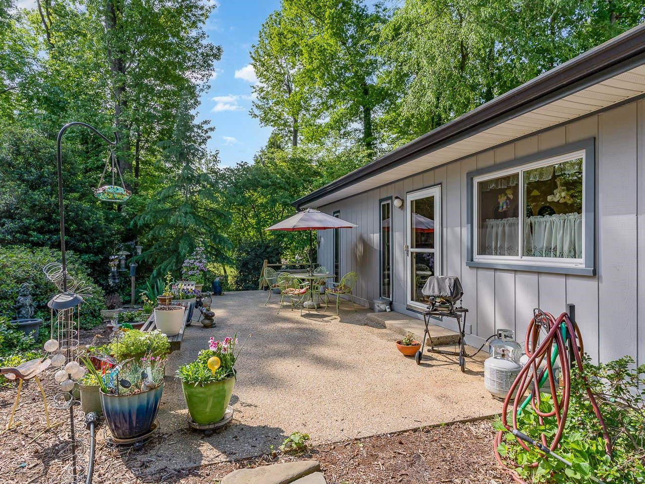 2104 Jarman Drive Raleigh, NC 27604 - Photo 9 of 37 a view of a backyard with sitting area and furniture