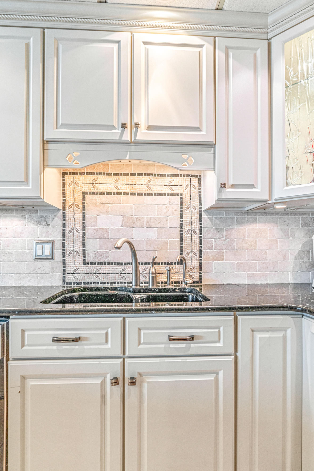197 Durango Road, Unit 6A Destin, FL 32541 - Photo 12 of 43 a kitchen with granite countertop white cabinets and a window