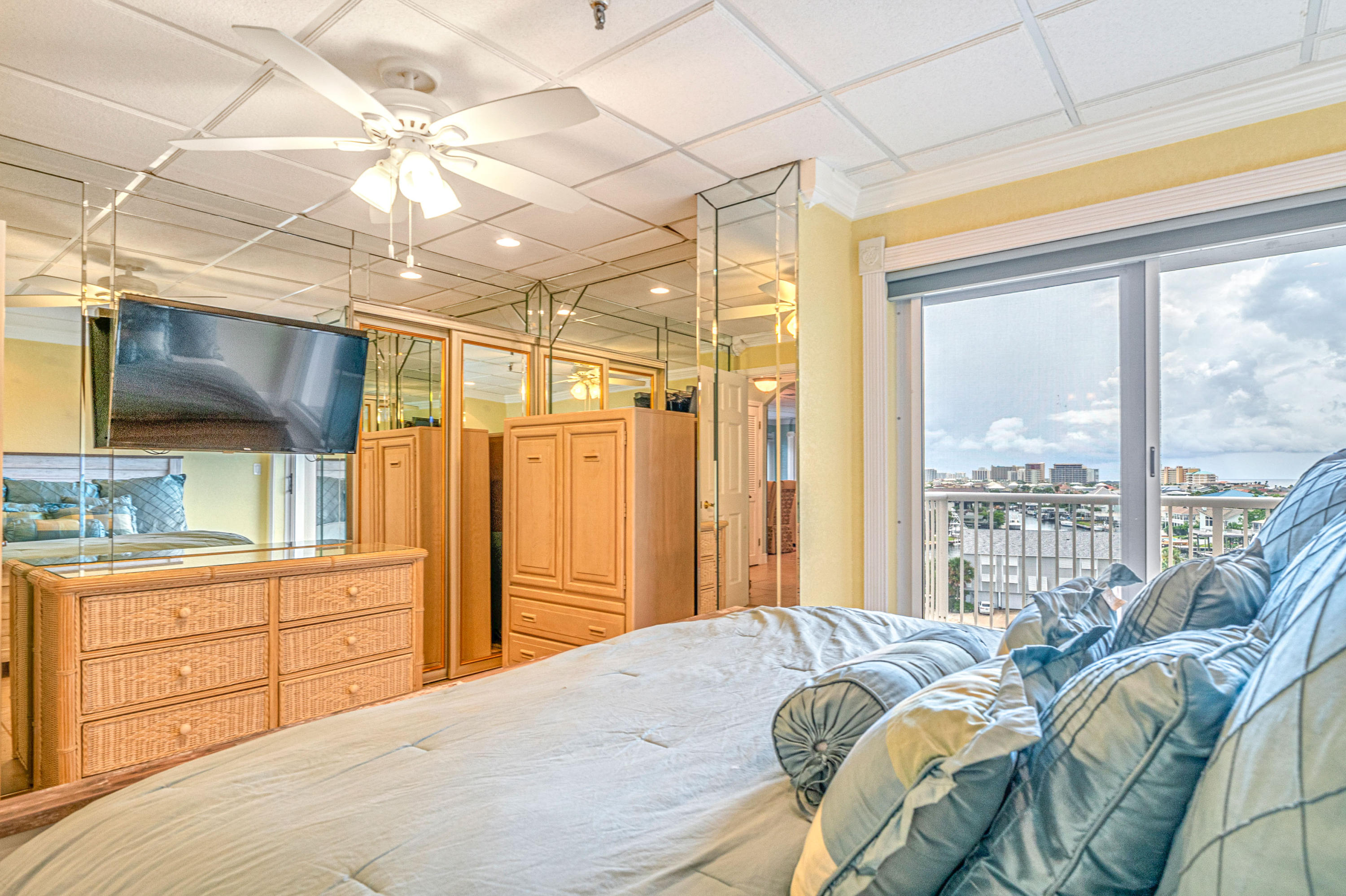 197 Durango Road, Unit 6A Destin, FL 32541 - Photo 16 of 43 a bedroom with a bed and a large window
