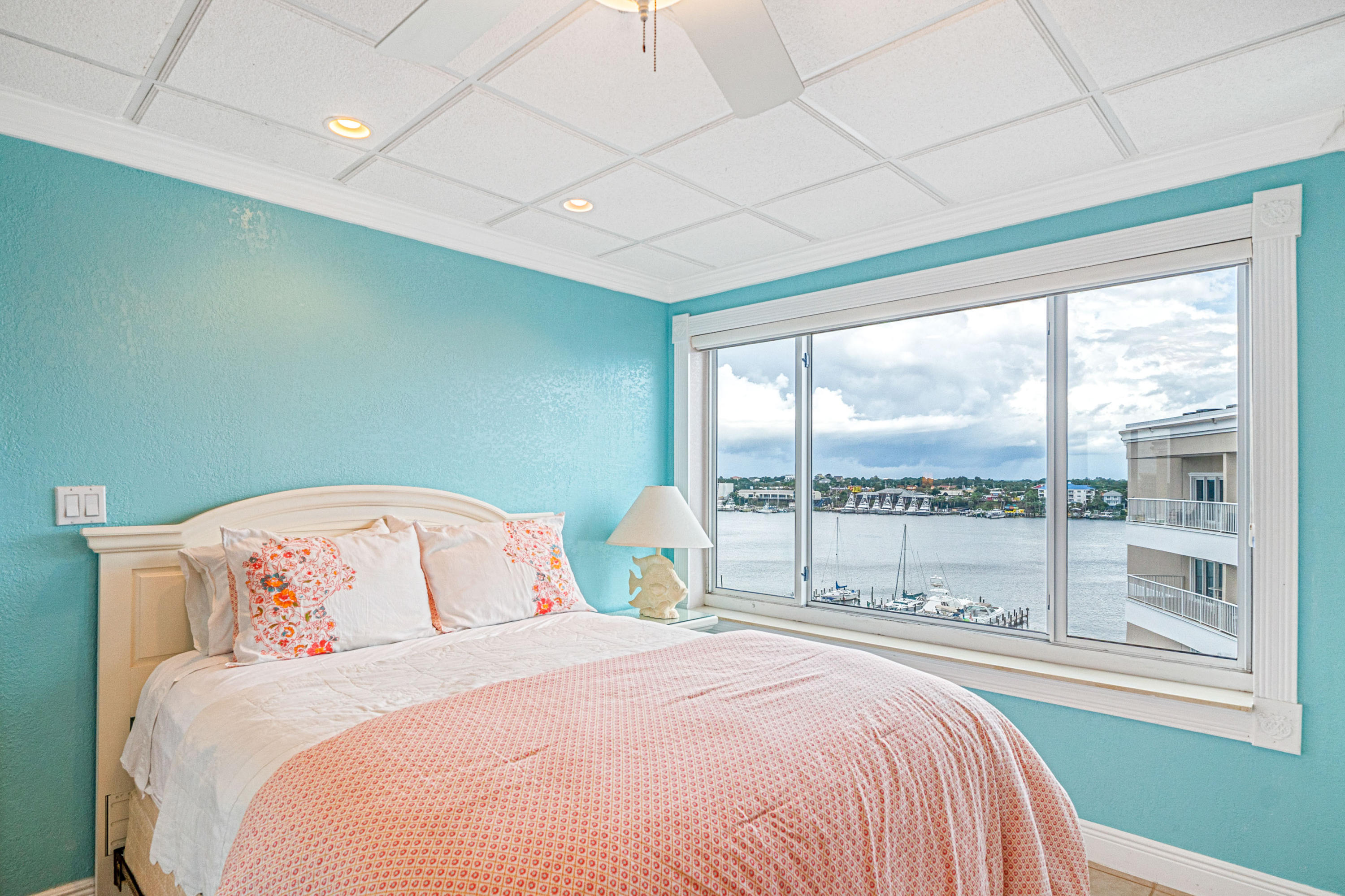 197 Durango Road, Unit 6A Destin, FL 32541 - Photo 22 of 43 a bedroom with a large bed and a large window