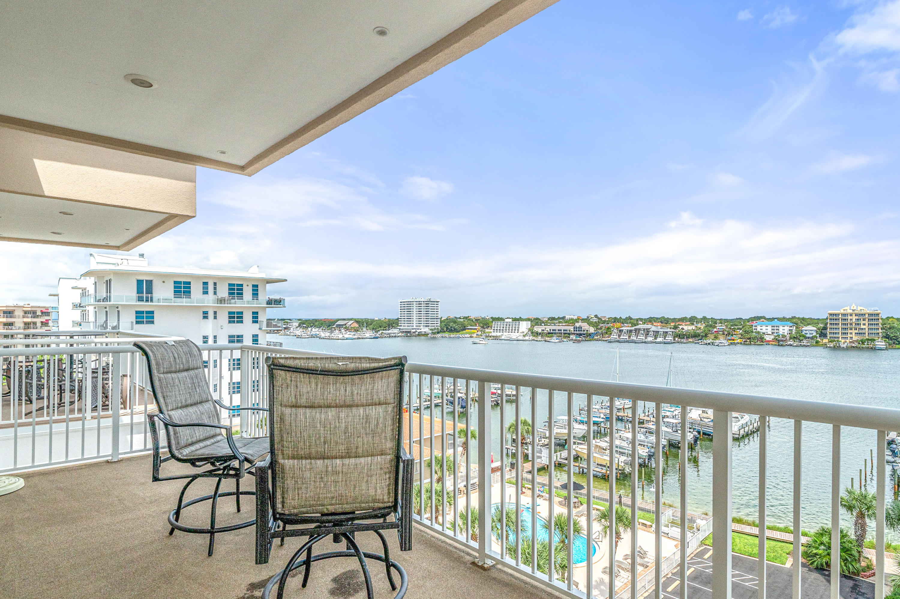 197 Durango Road, Unit 6A Destin, FL 32541 - Photo 4 of 43 a view of a chairs and table in the balcony
