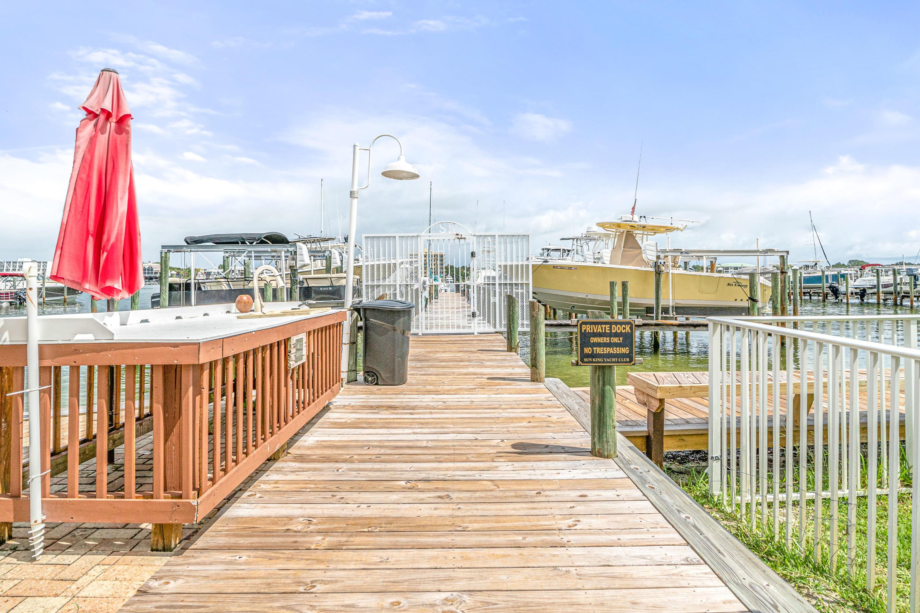 197 Durango Road, Unit 6A Destin, FL 32541 - Photo 34 of 43 a view of a balcony with two chairs and wooden floor