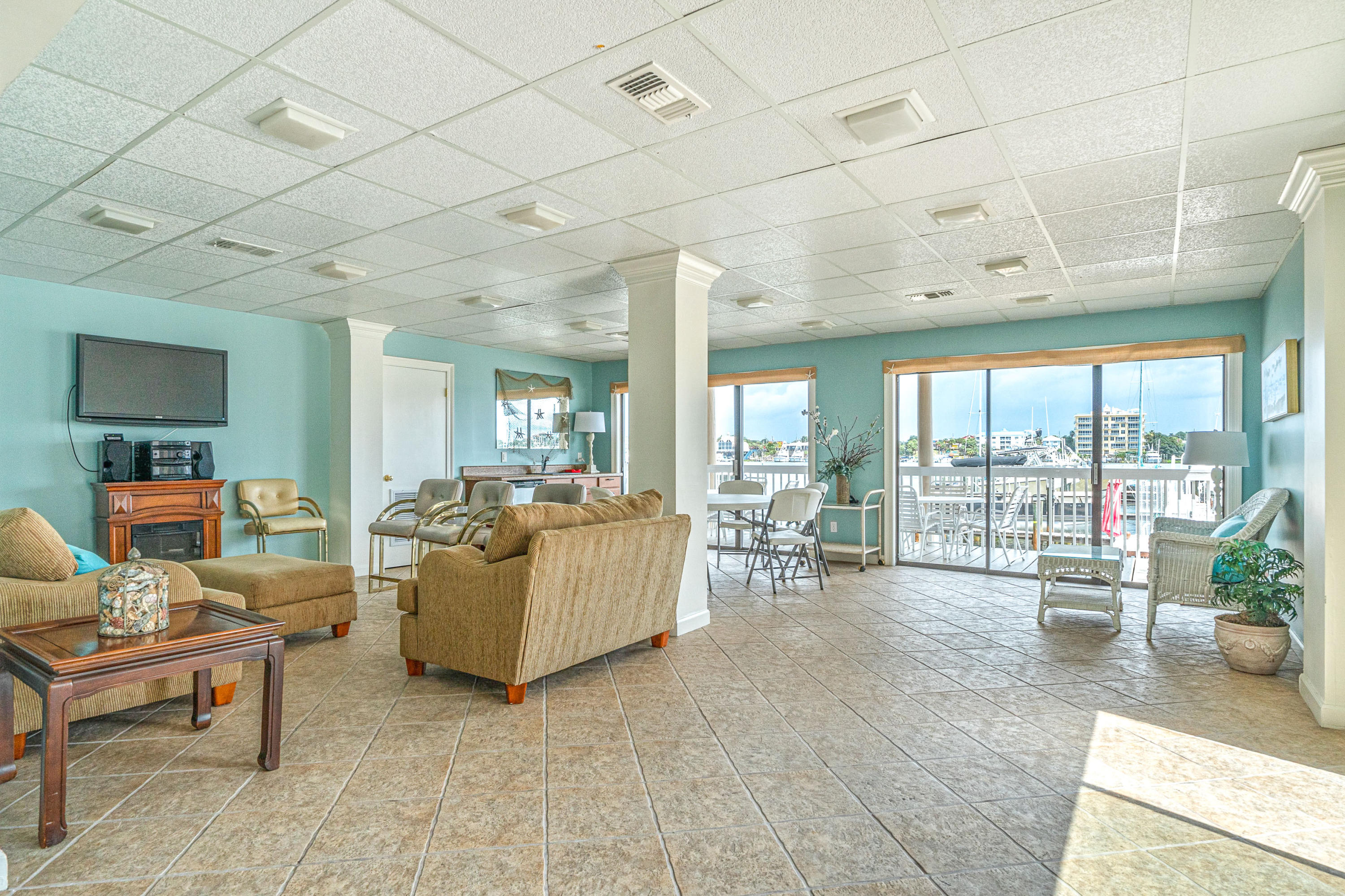 197 Durango Road, Unit 6A Destin, FL 32541 - Photo 35 of 43 a living room with furniture and a floor to ceiling window