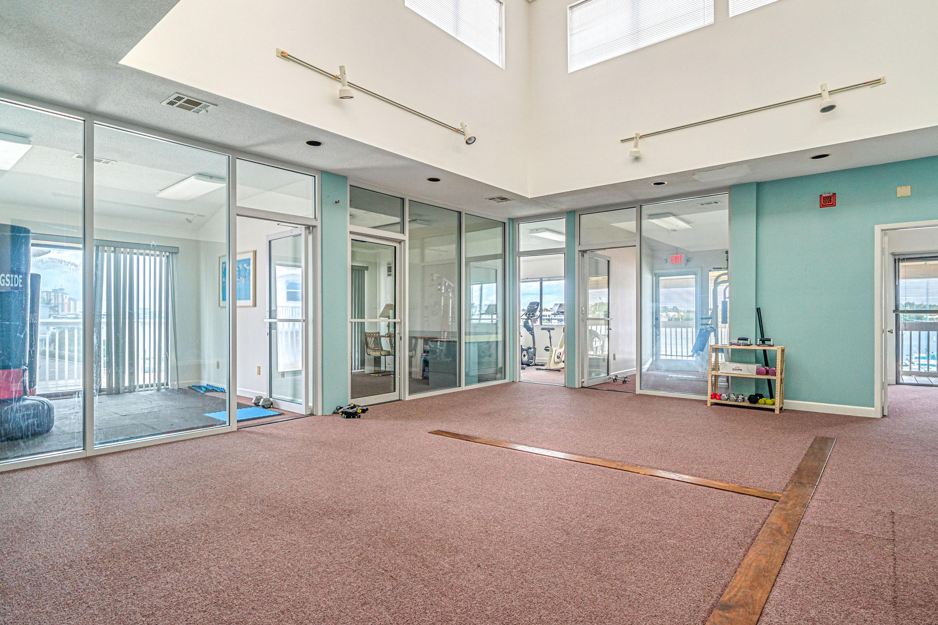 197 Durango Road, Unit 6A Destin, FL 32541 - Photo 36 of 43 a view of an empty room with floor to ceiling window