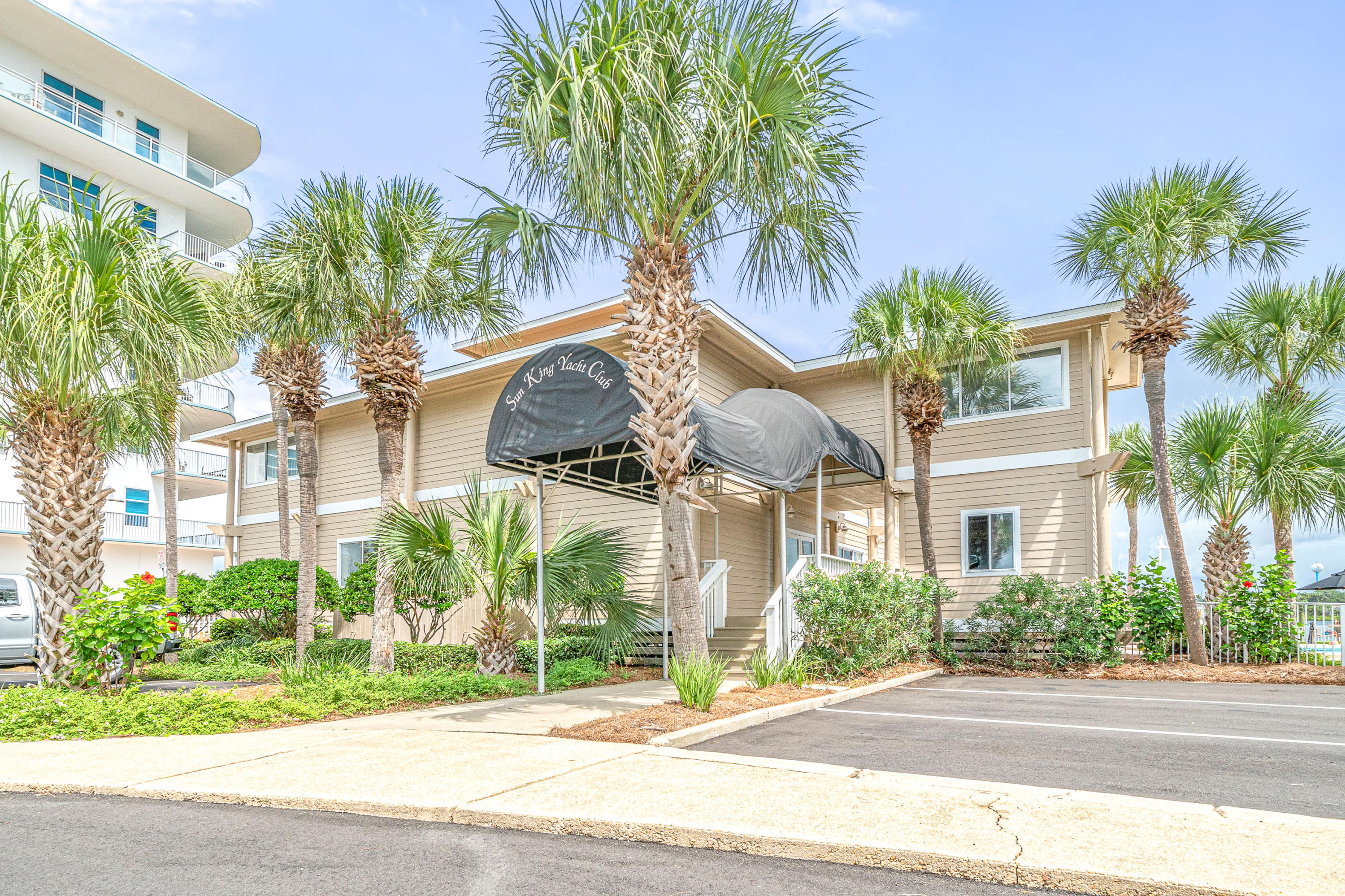 197 Durango Road, Unit 6A Destin, FL 32541 - Photo 38 of 43 a view of a palm trees in front of a building