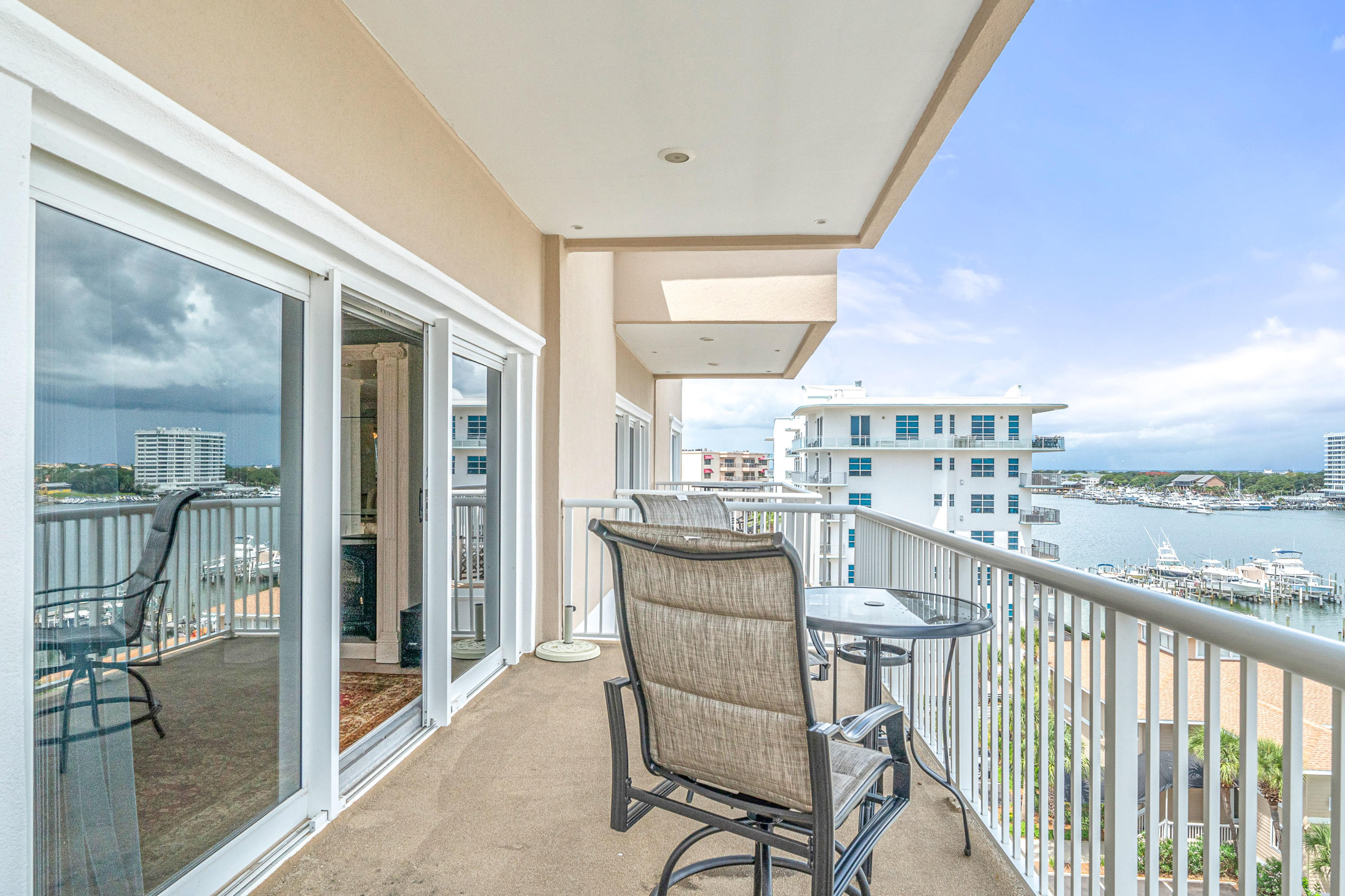 197 Durango Road, Unit 6A Destin, FL 32541 - Photo 5 of 43 a dining room with furniture and a floor to ceiling window