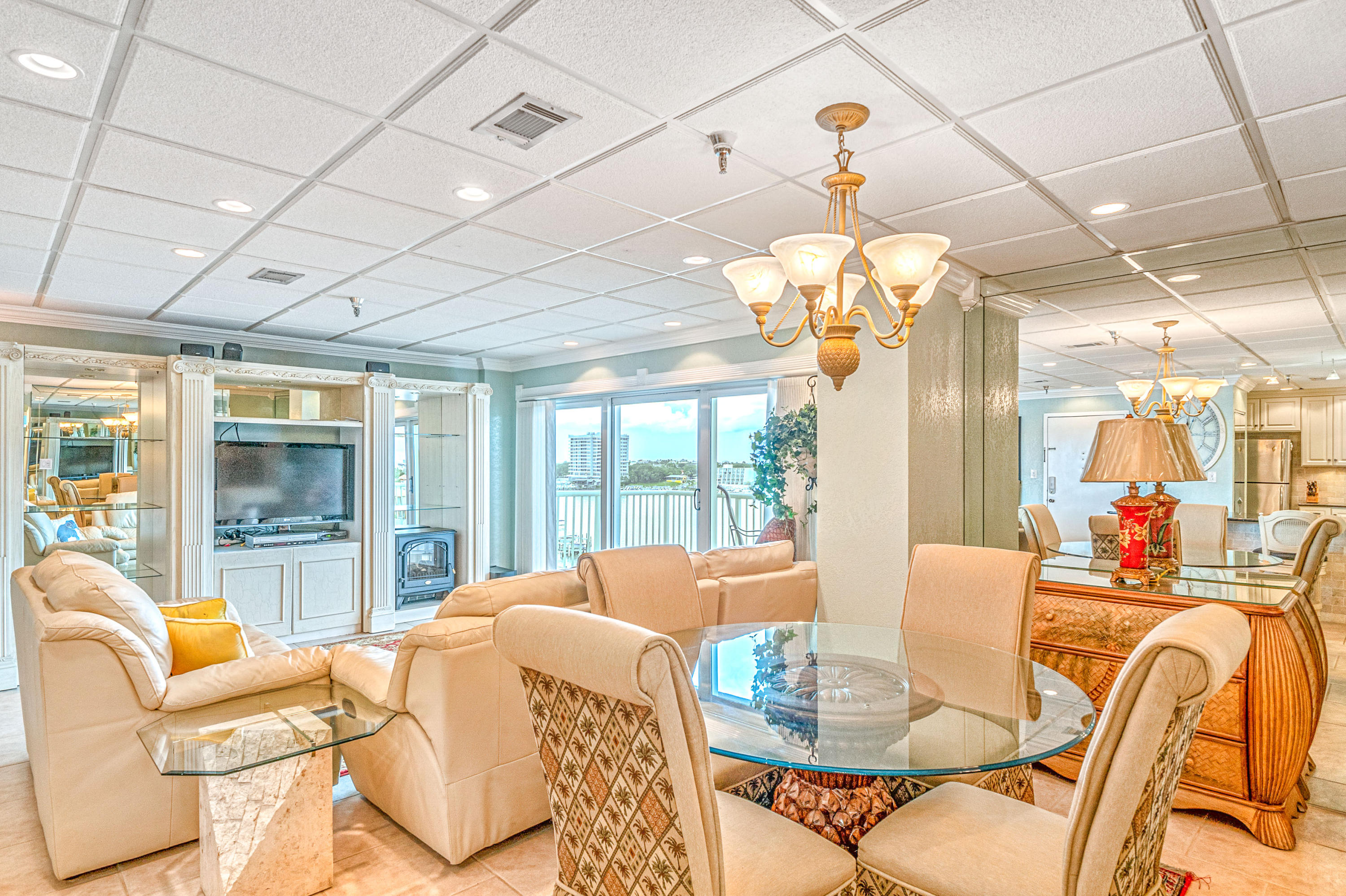 197 Durango Road, Unit 6A Destin, FL 32541 - Photo 7 of 43 a view of a dining room with furniture wooden floor and chandelier